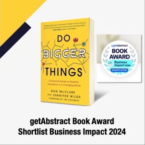 A yellow book titled "Do Bigger Things" with a subtitle "A Pragmatic Guide to Powerfully Innovate in a Changing World," by Dan McClure and Jennifer Wilde is shown next to a getAbstract Book Award for Business Impact 2024, which is a gold and silver ribbon badge.