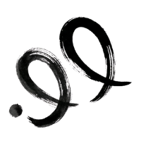 Close-up of black, circular rubber or silicone rings with a glossy finish, likely jewelry or accessories.