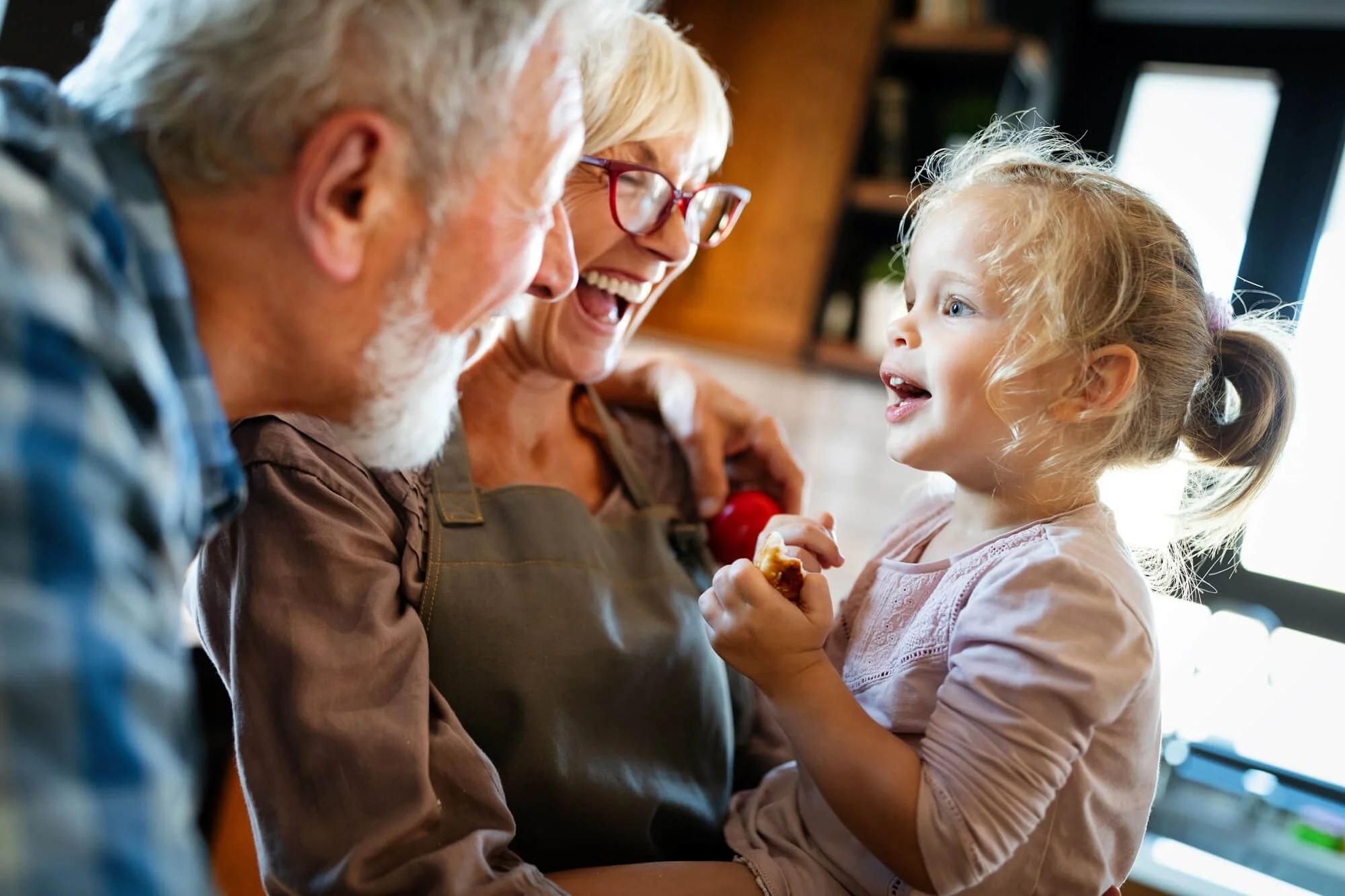 Happy grandchild with grandparents