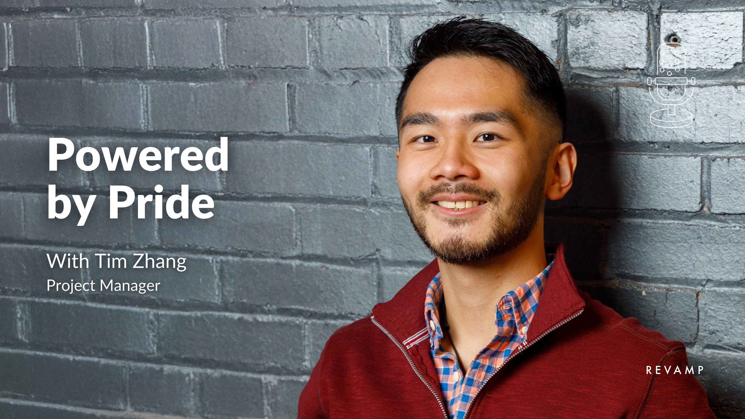 A man in a red jacket and plaid shirt smiling against a gray brick wall, with overlay text saying 'Powered by Pride' and 'With Tim Zhang, Project Manager.'