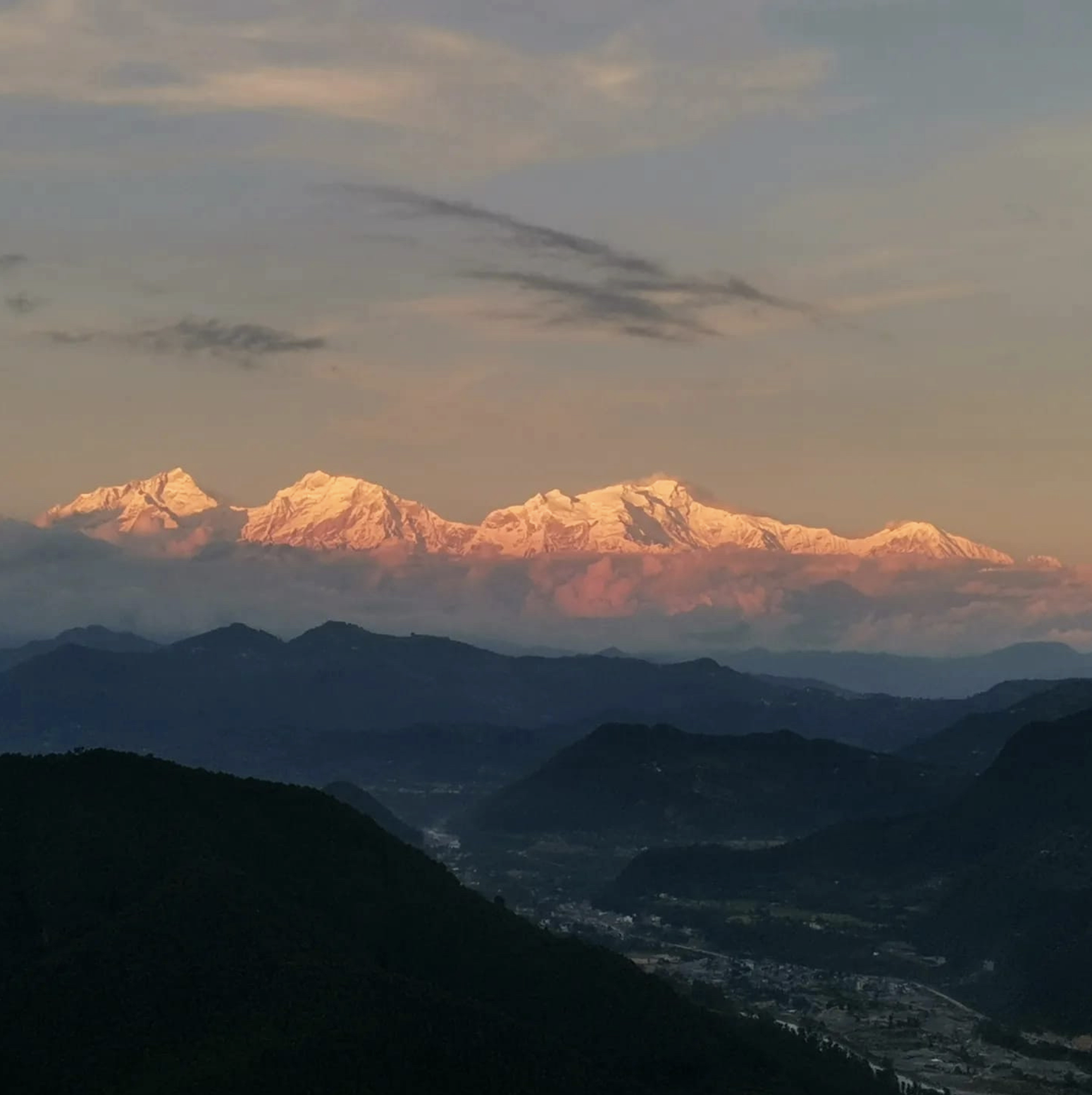 Snow-capped Himalayas at sunrise with some clouds and a valley below. Wildlife expedition and phot safari with Wild Selection Tours.