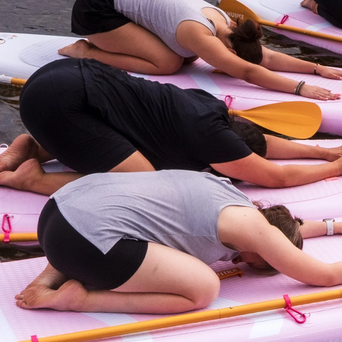 stretching on paddle board