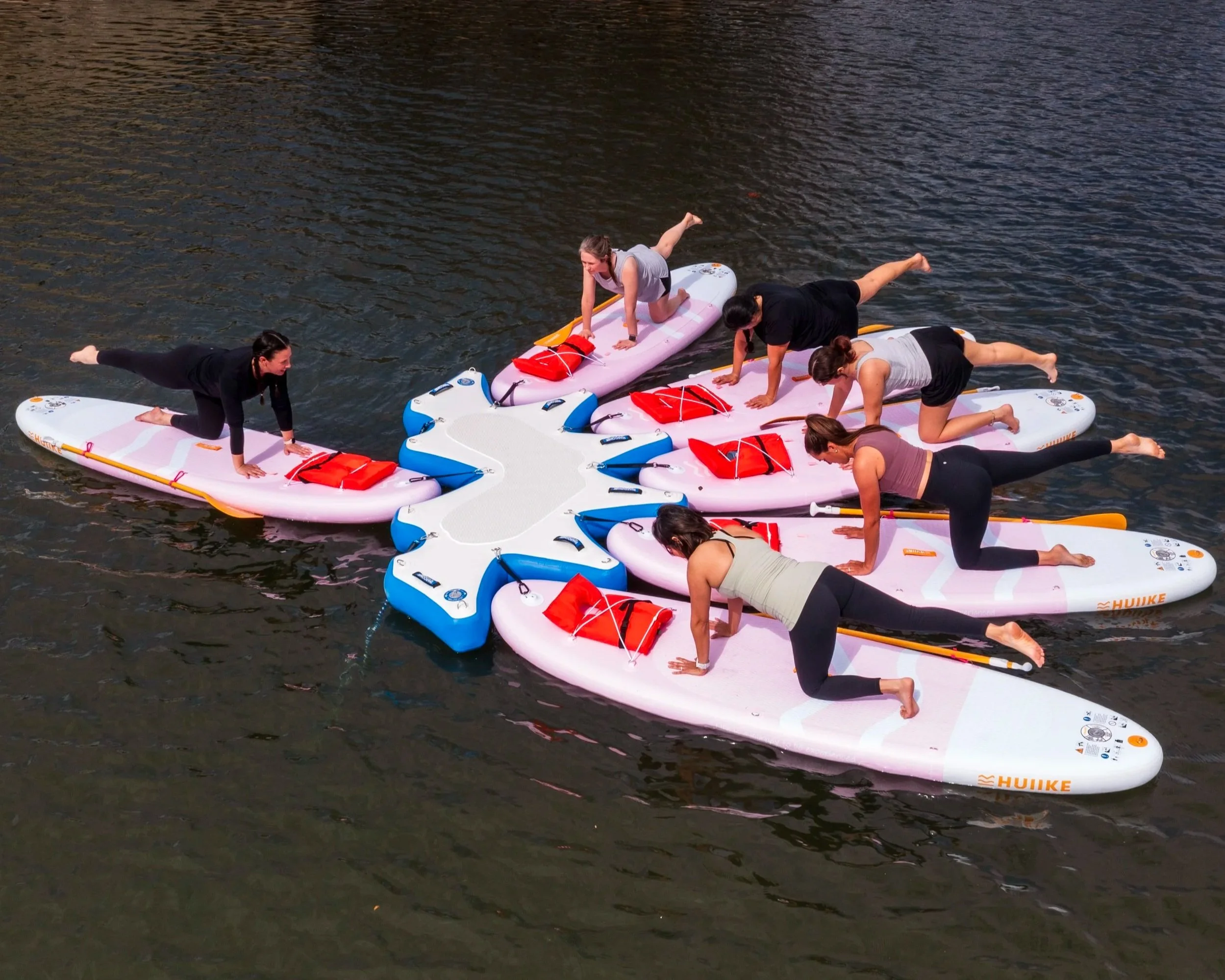 Group paddleboard fitness class at Lake LBJ