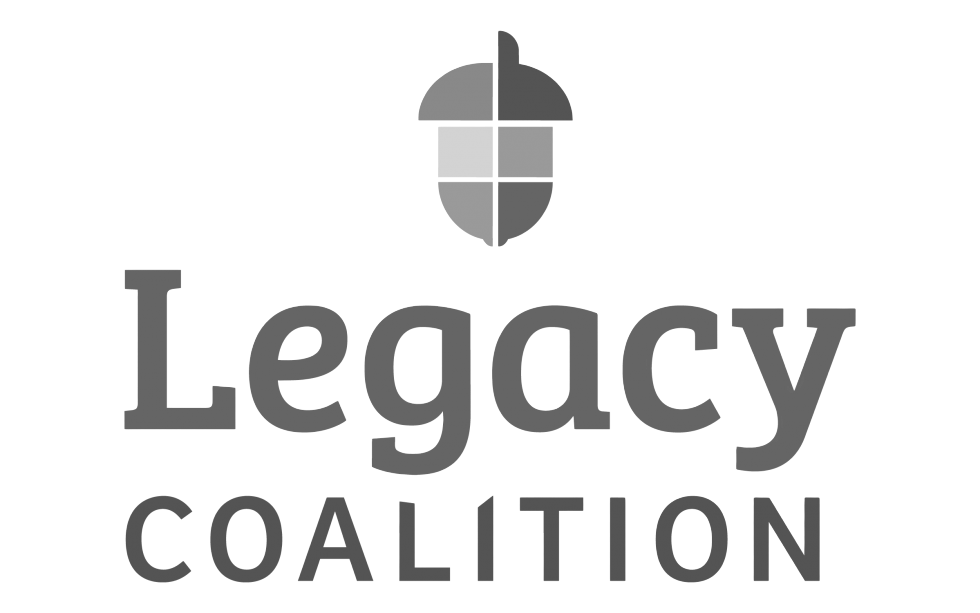 A logo for the Legacy Coalition featuring a stylized cross with a rounded top and bottom, divided into four segments, and the words "Legacy" in large font and "Coalition" in smaller font underneath.