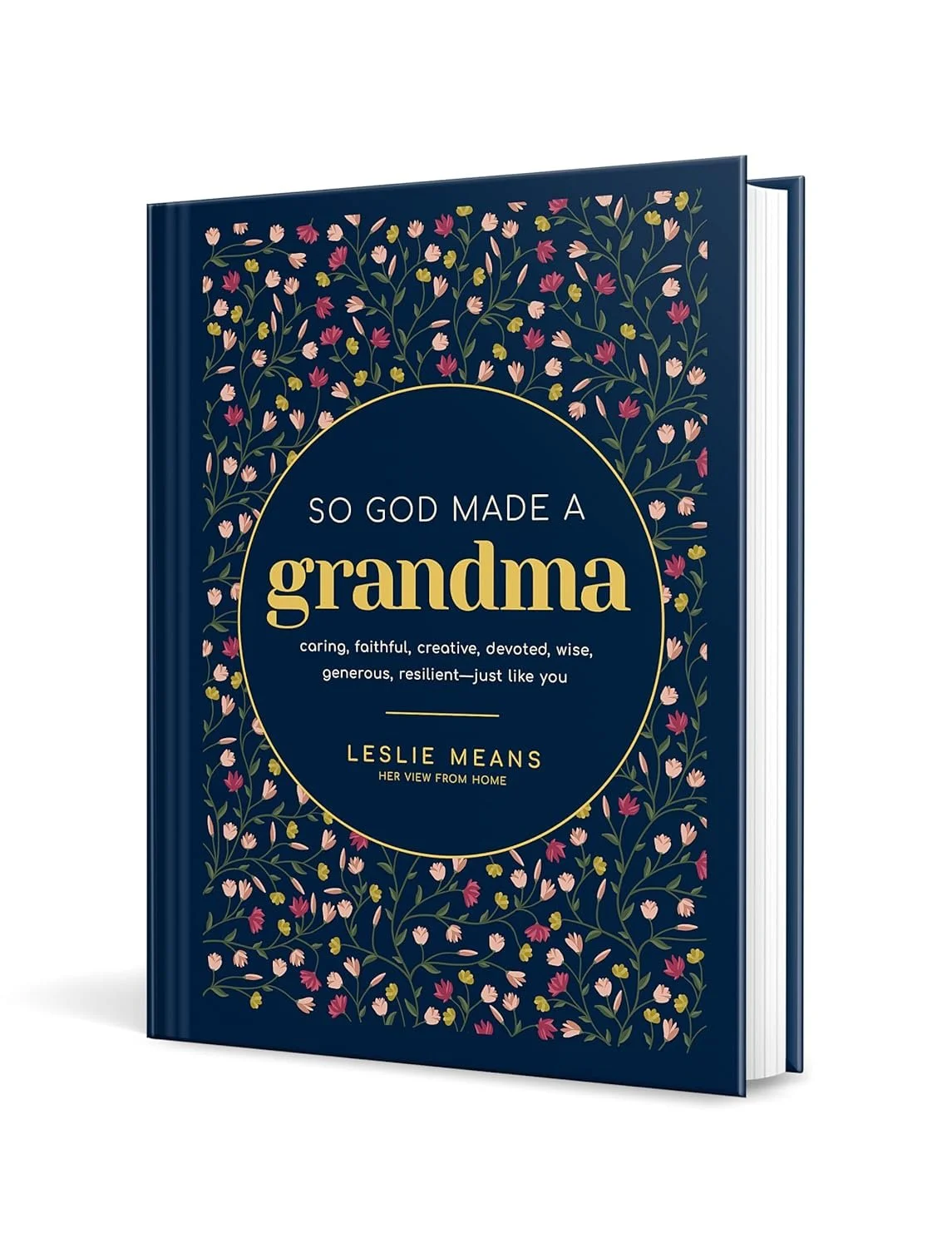 A hardcover book titled "So God Made a Grandma" by Leslie Means with writings by Author Debbie Prather with a dark blue cover decorated with pink, cream, and purple flowers and green leaves.