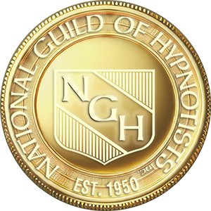 Close-up of a gold coin featuring the National Guild of Hypnotists (NGH) logo and the text 'NATIONAL GUILD OF HYPNOTISTS EST. 1950' around the edge.