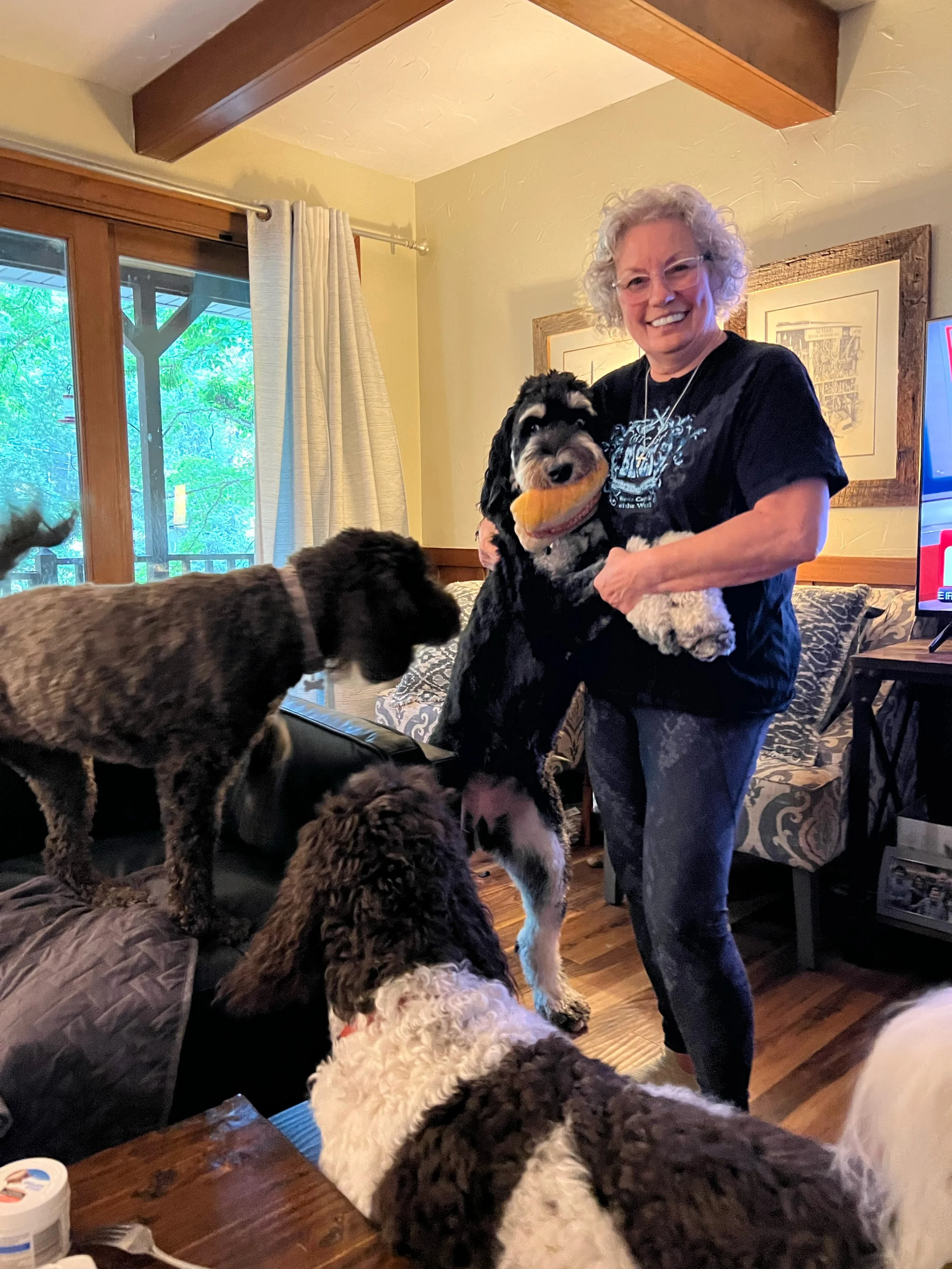 Amy Melendy at home with her three of her four dogs in Knoxville, Tennessee