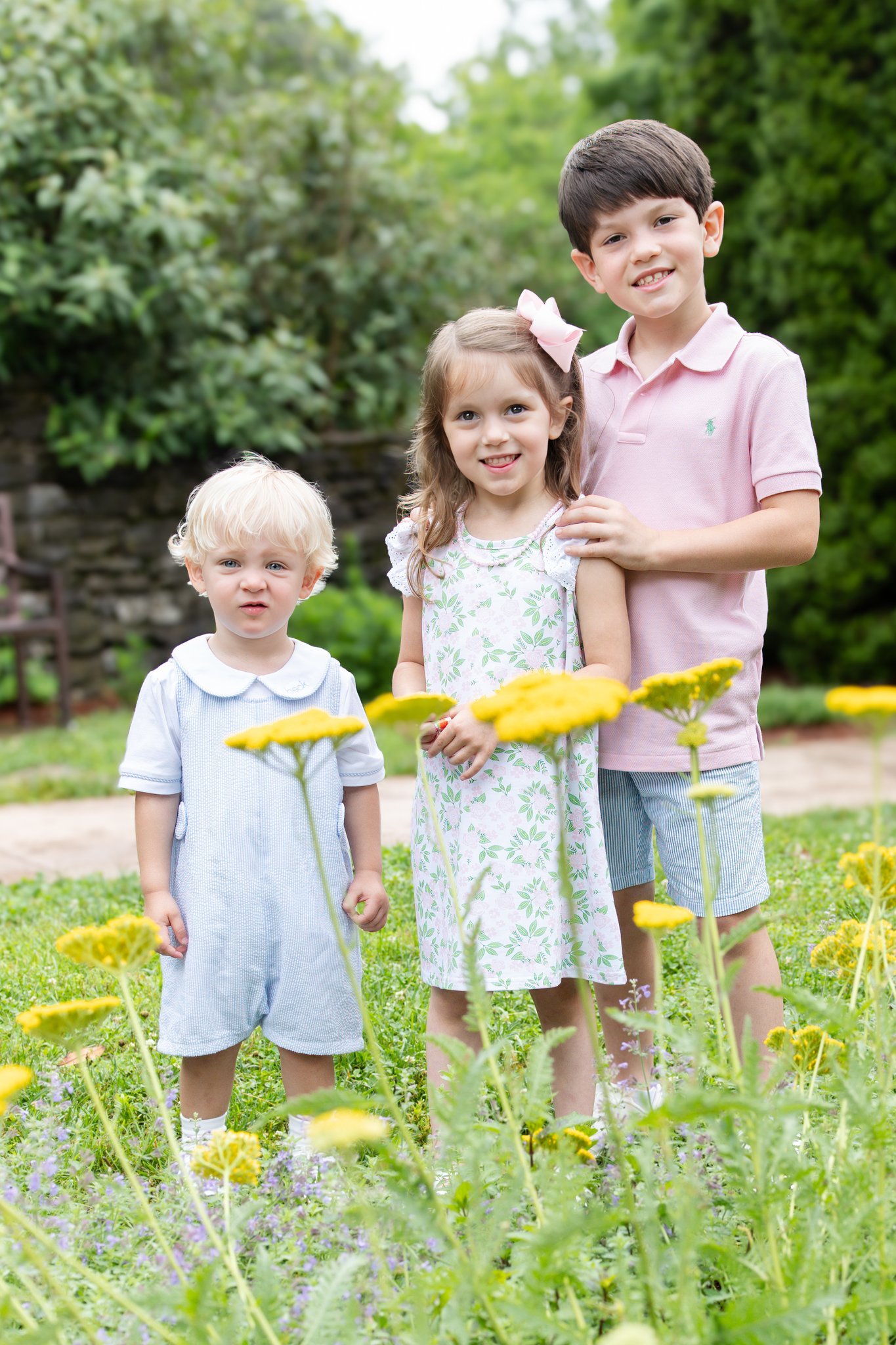 Three siblings among wildflowers at the Knoxville Botanical Garden and Arboretum.
