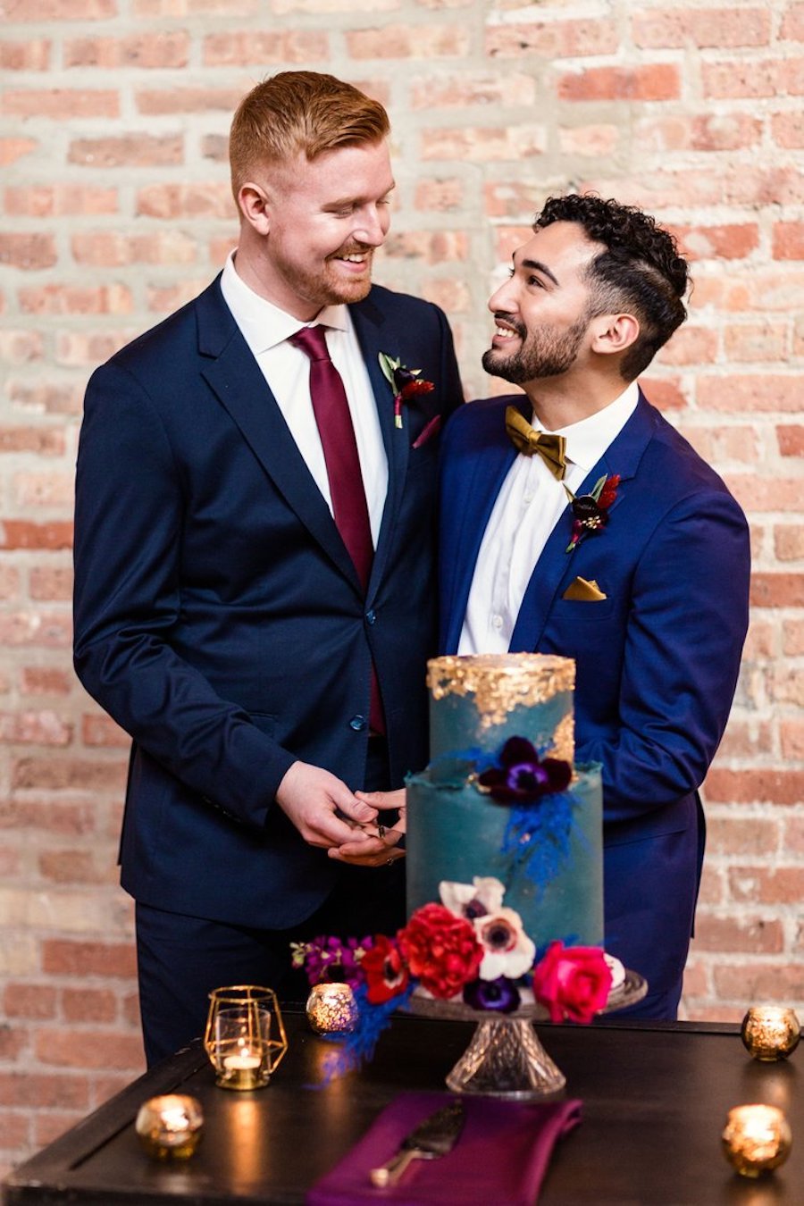 2 tier wedding cake ideas - couple cutting their wedding cake