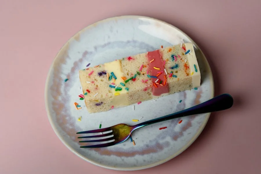 best kitchenaid attachment for frosting - a cut slice of cake on a plate