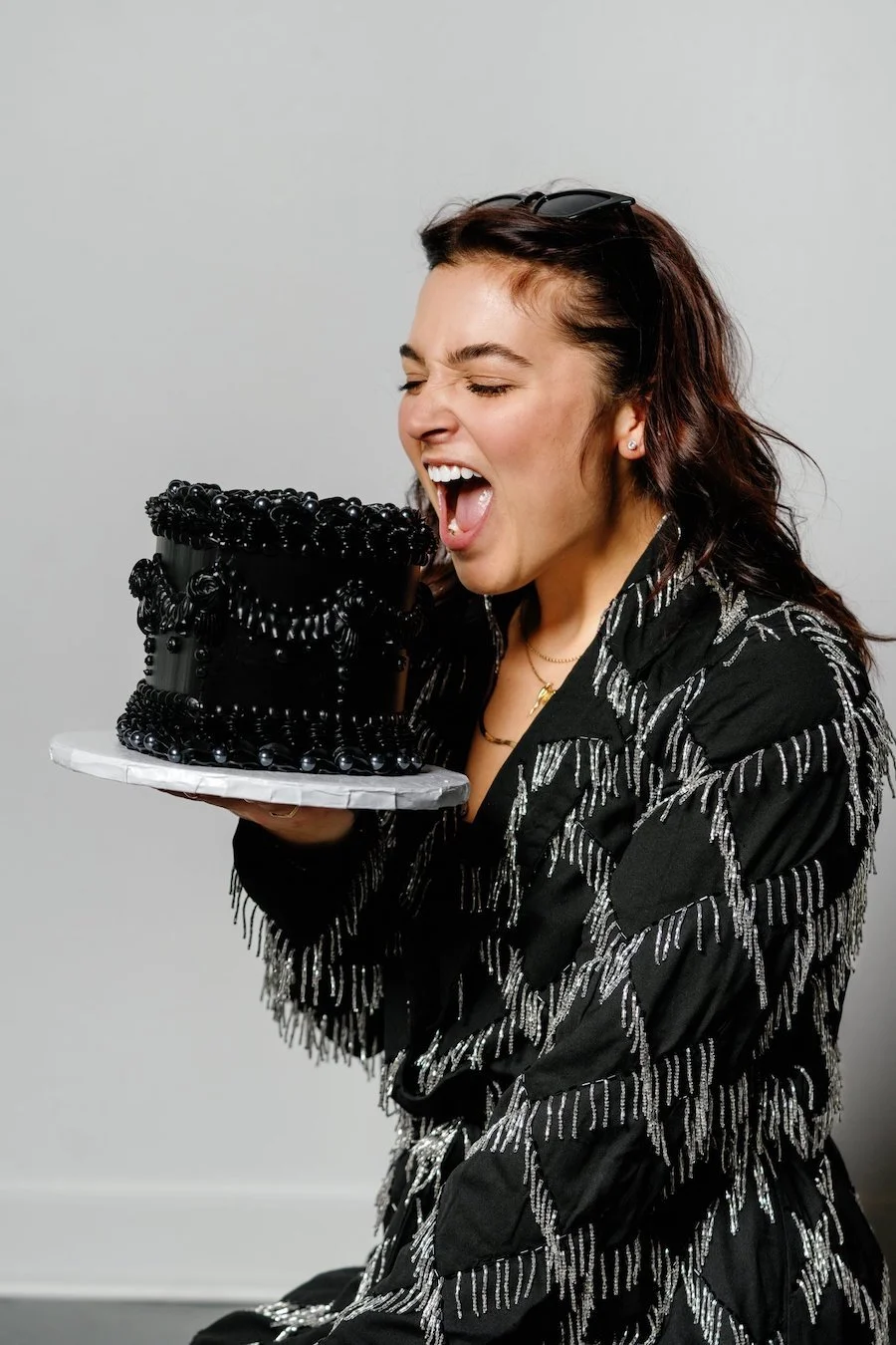 can you freeze buttercream frosting? woman holding buttercream-frosted cake