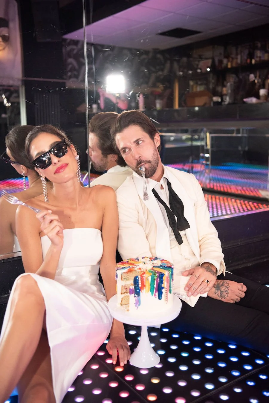 what makes cake dense vs fluffy - photo of couple with cake sitting on the floor