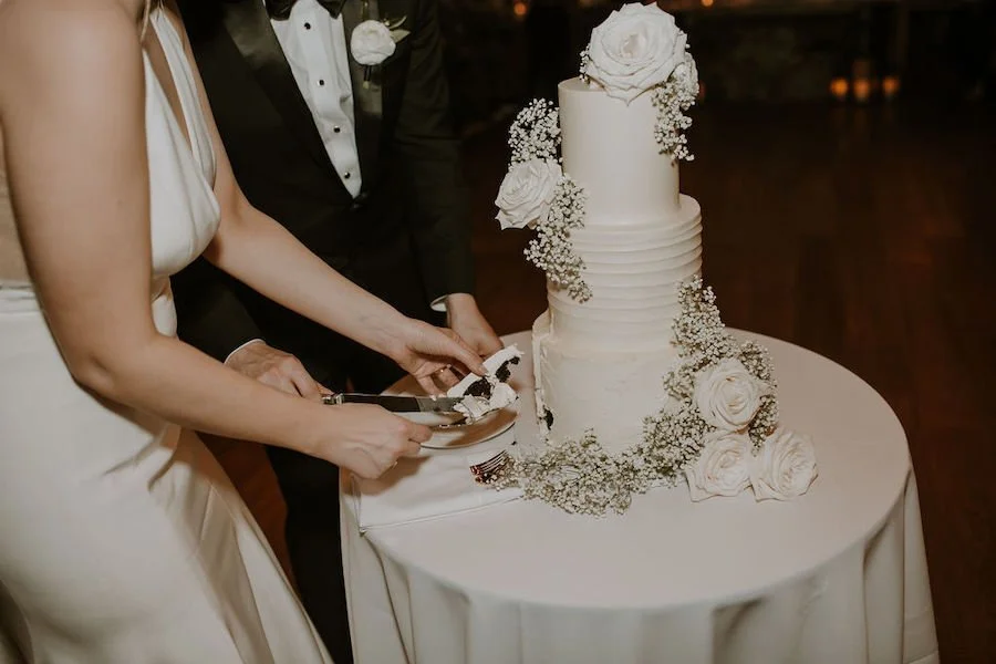 DIY wedding cake - couple cutting their wedding cake