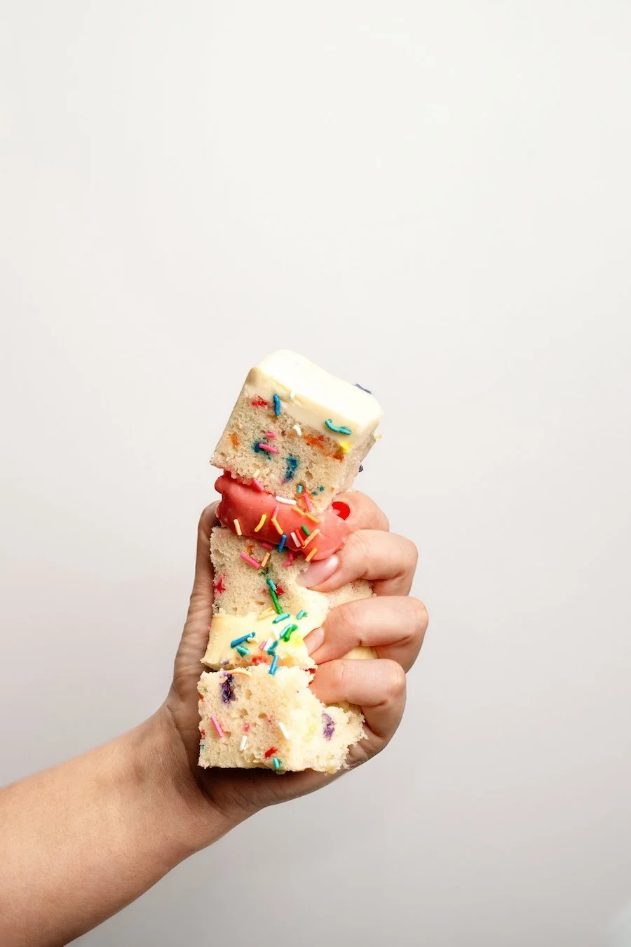 freezing buttercream how to - slice of cake getting squished in someone's hand