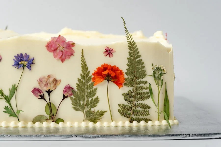 how long does frosted cake last in the fridge? sheet cake frosted and decorated with pressed flowers