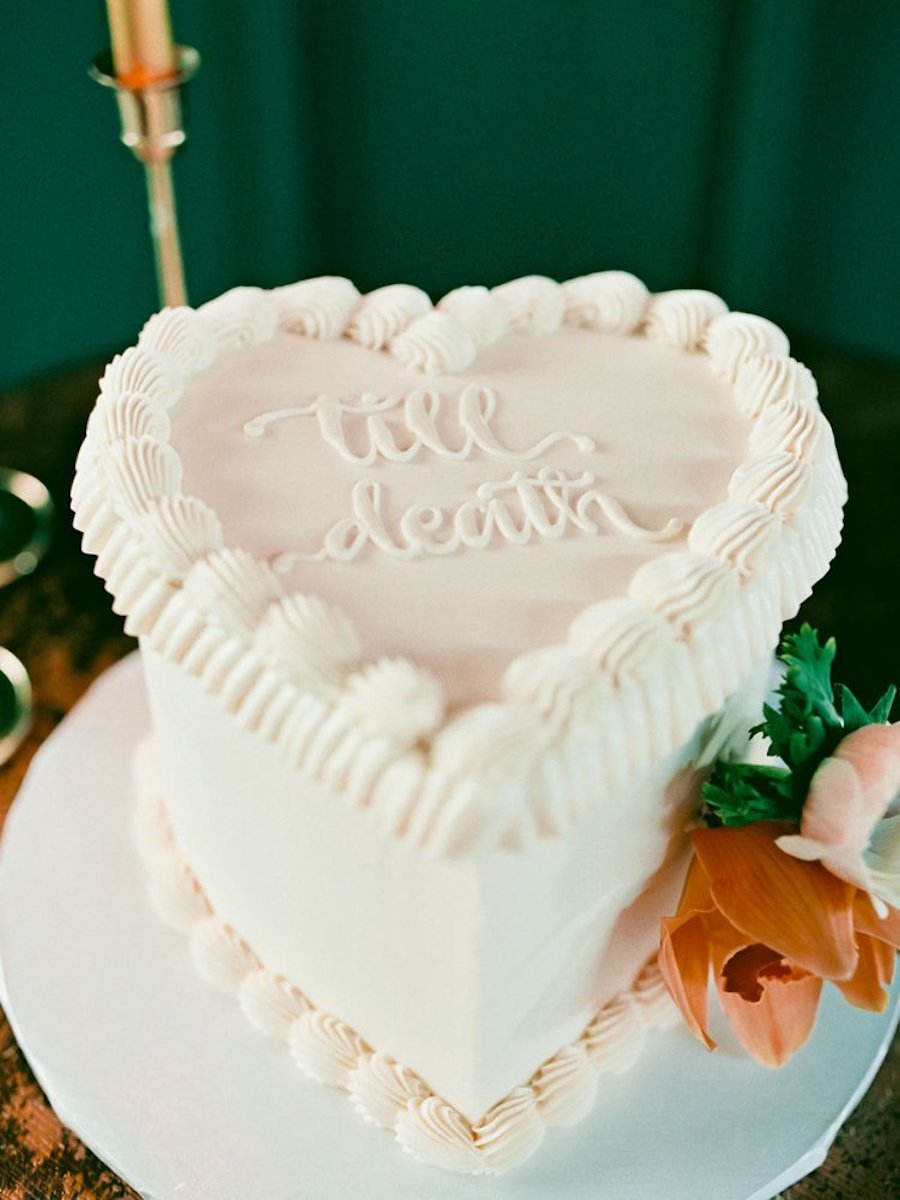 how to freeze your wedding cake - photo of a heart-shaped cake with "til death" written on it