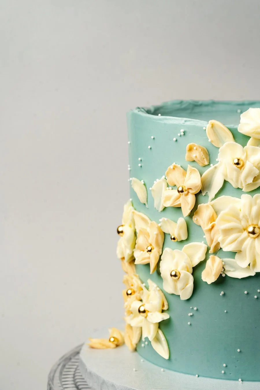 how to make buttercream flowers - a cake decorated with flowers