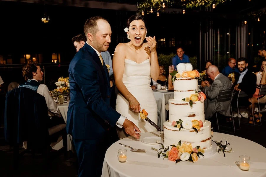 rustic wedding cake ideas - couple cutting a semi-naked cake