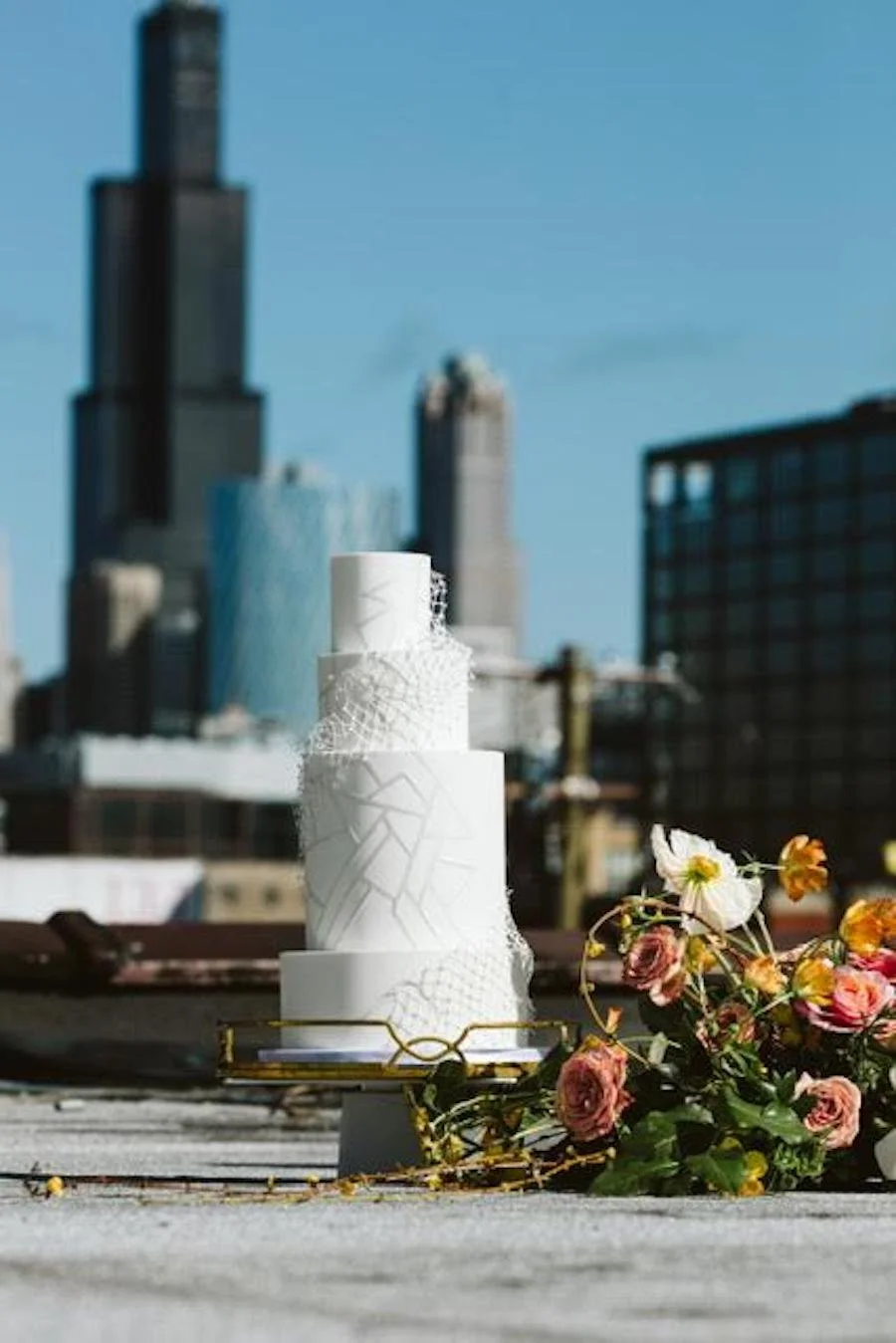 how much does a wedding cake cost in Chicago - wedding cake in front of Chicago skyline