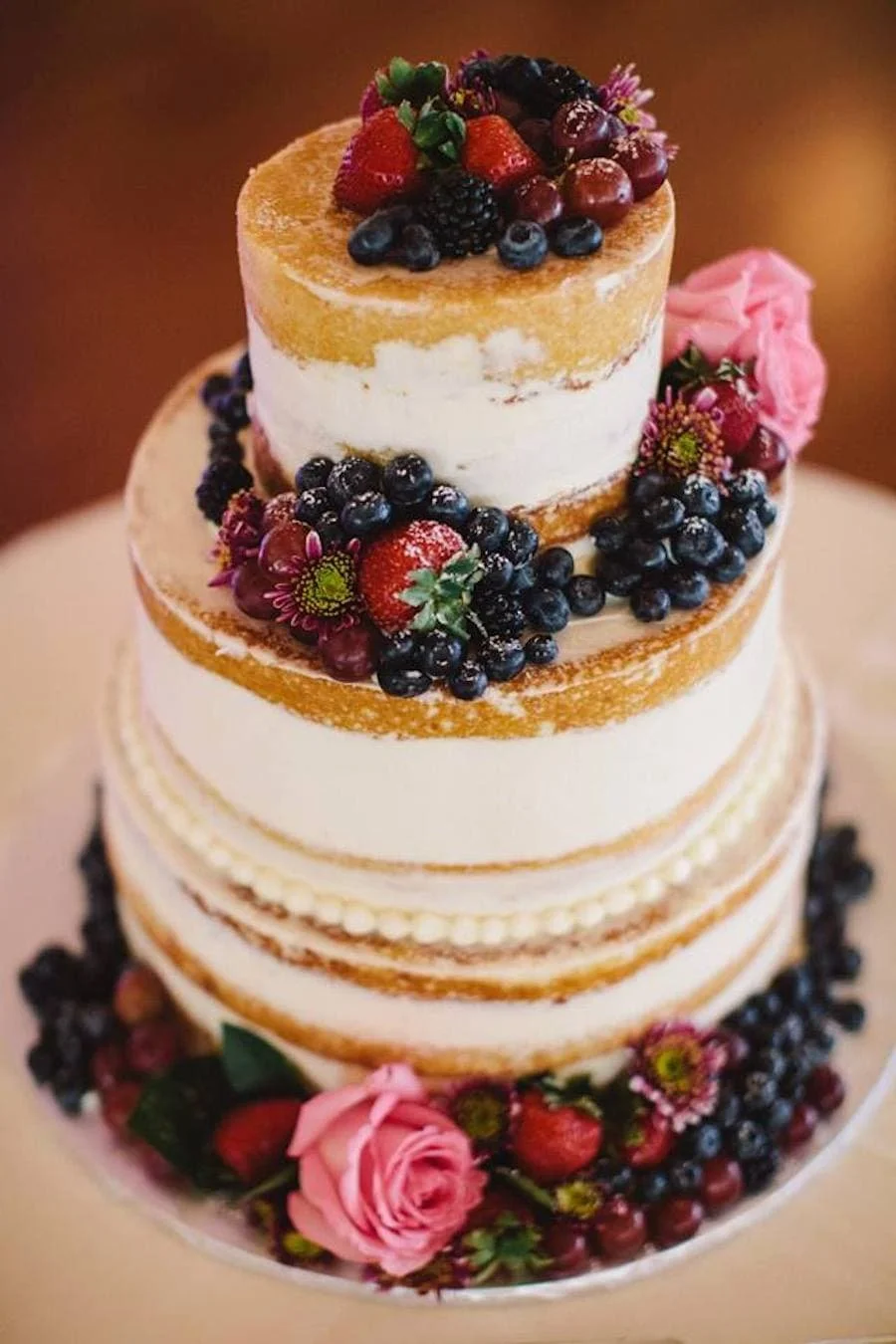 naked cake / naked cakes - naked wedding cake garnished with berries and grapes