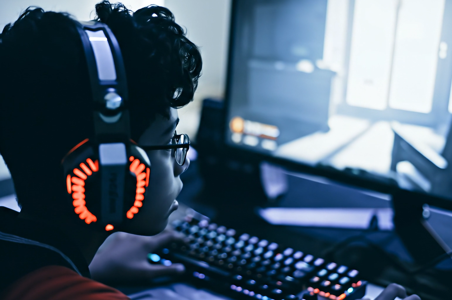 Teenager becoming distressed while playing a video game, highlighting the need for parent-guided controls in the Friend World app