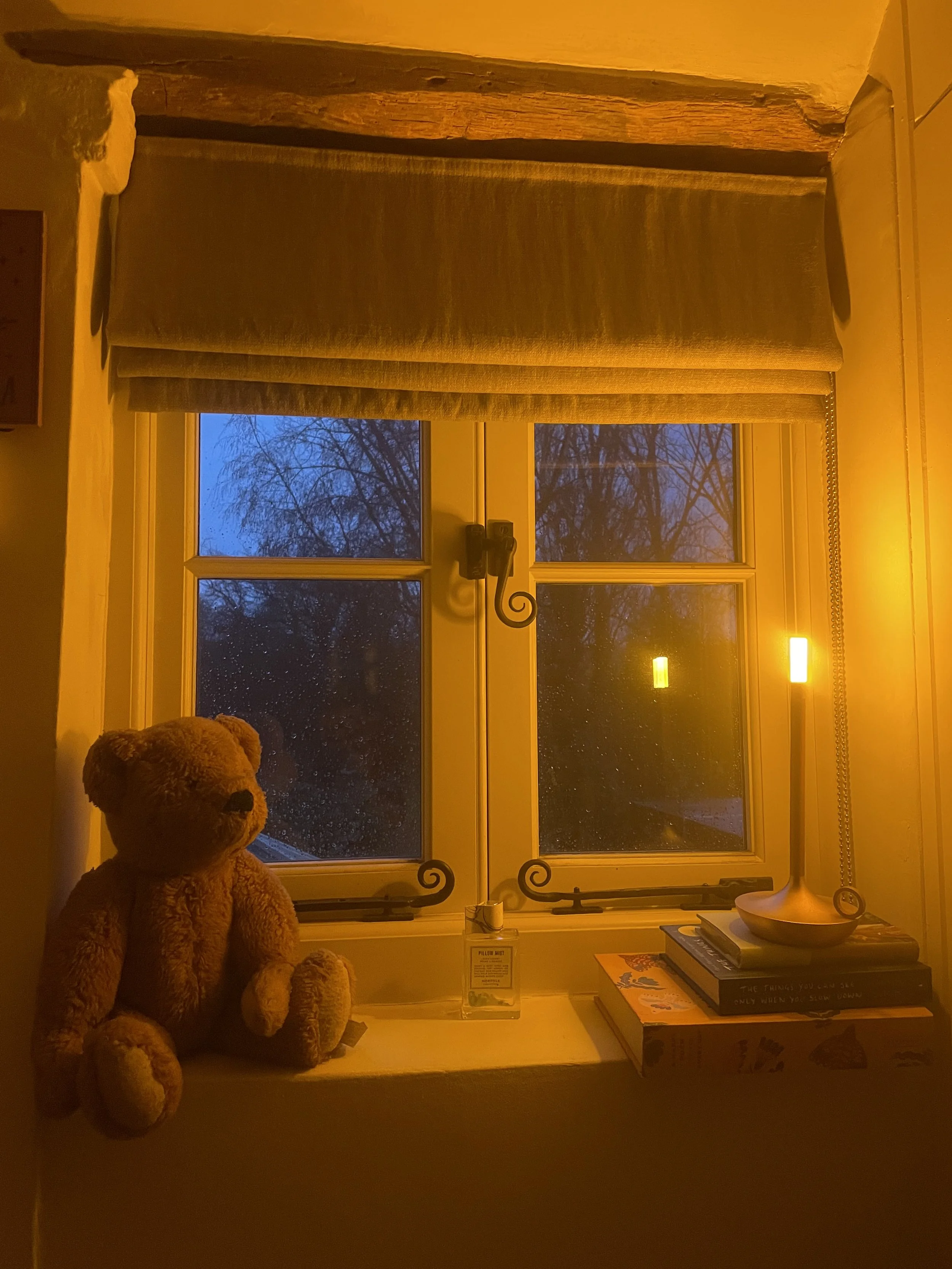 Moonlit night window with lamp and teddy