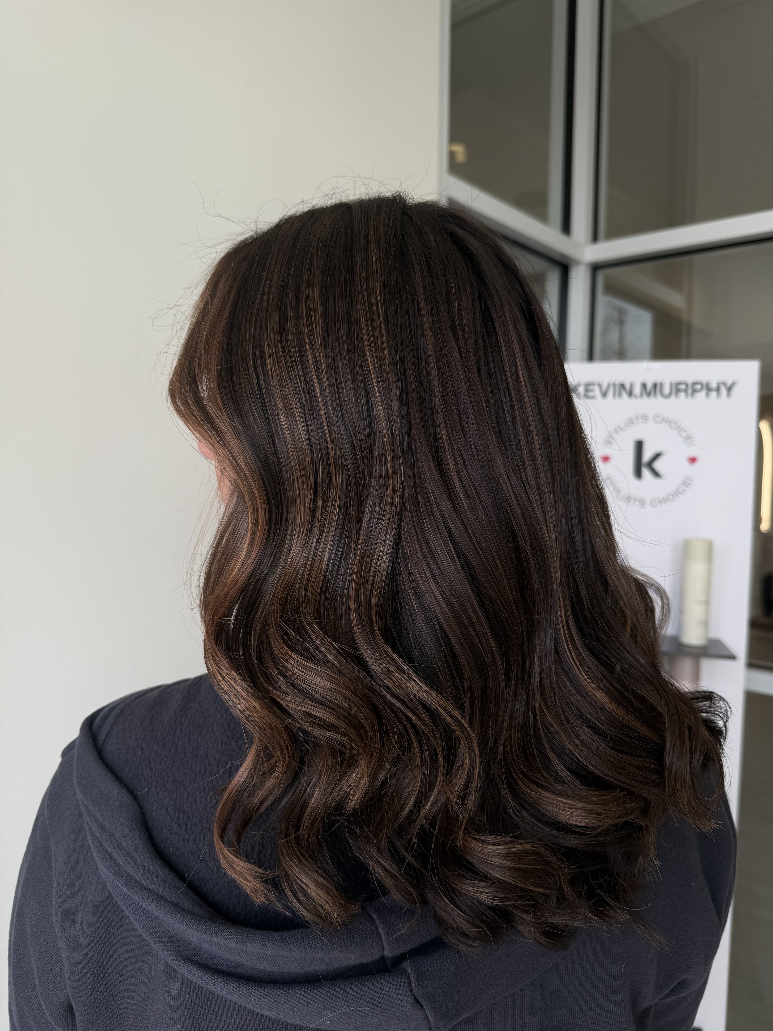 Dimensional brunette hair color at The Loft Salon in Bel Air, MD