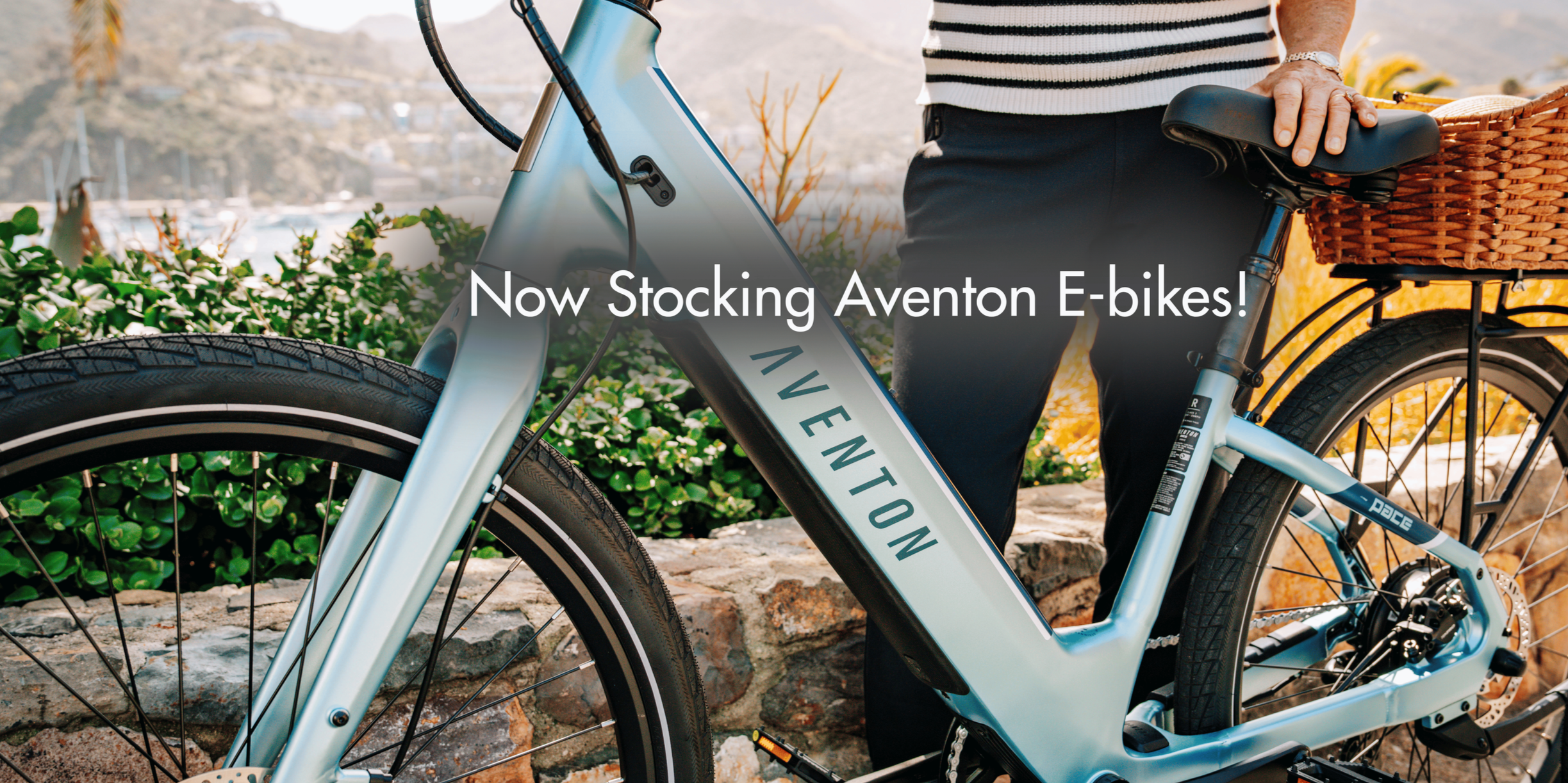 A black and silver bicycle with a drop handlebar, partially visible in a dark setting.