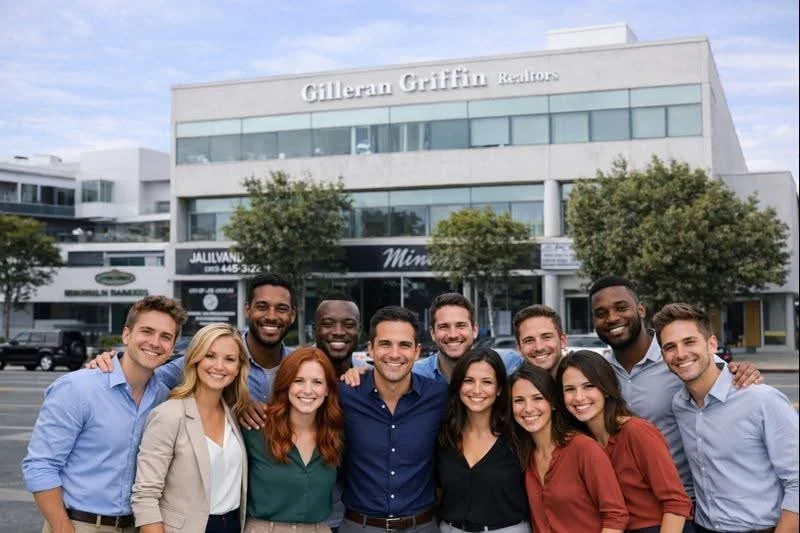 Group of diverse young professionals standing in front of a modern office building, smiling.