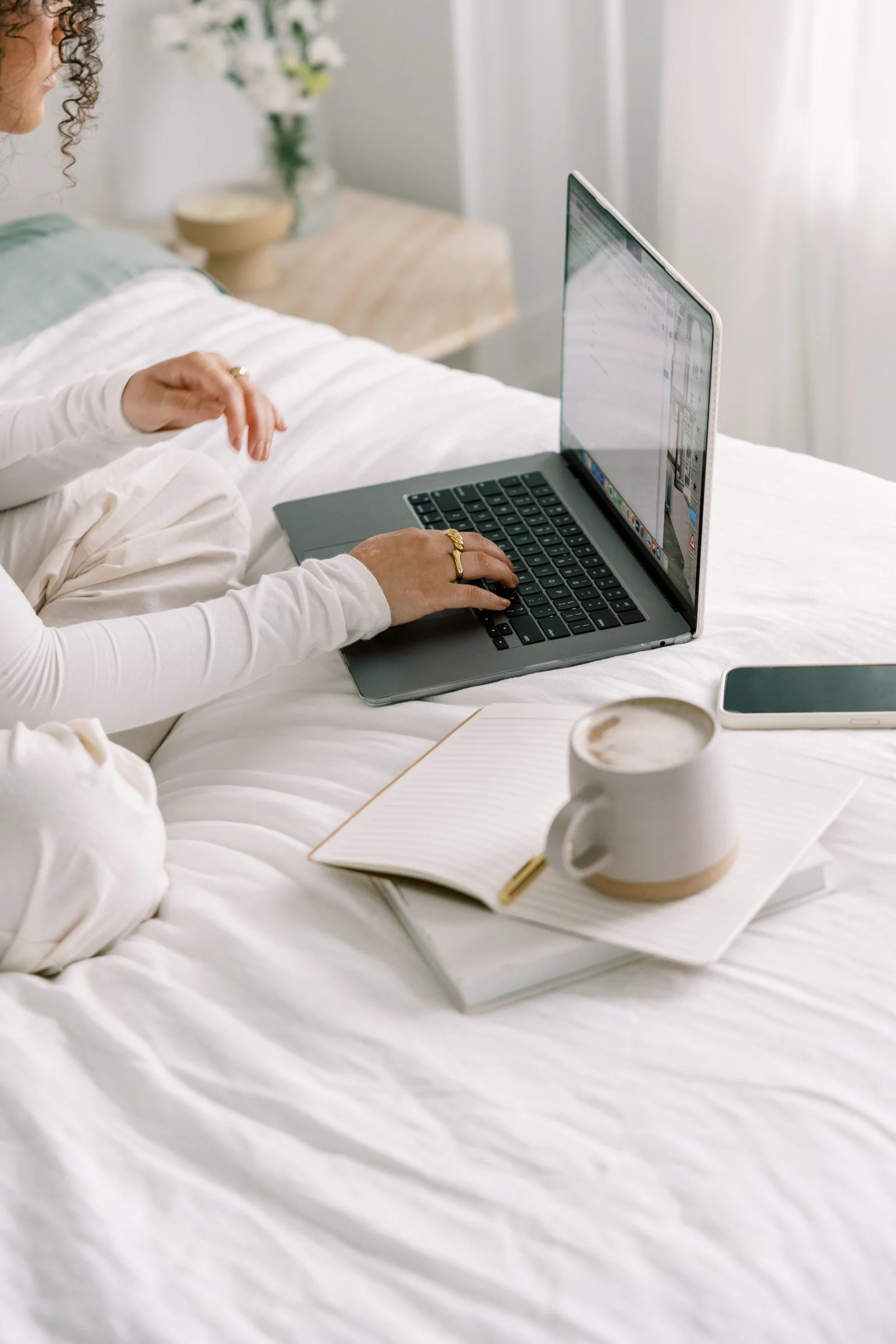 Woman enjoying quiet time with coffee and Bible, representing slowing down to hear God