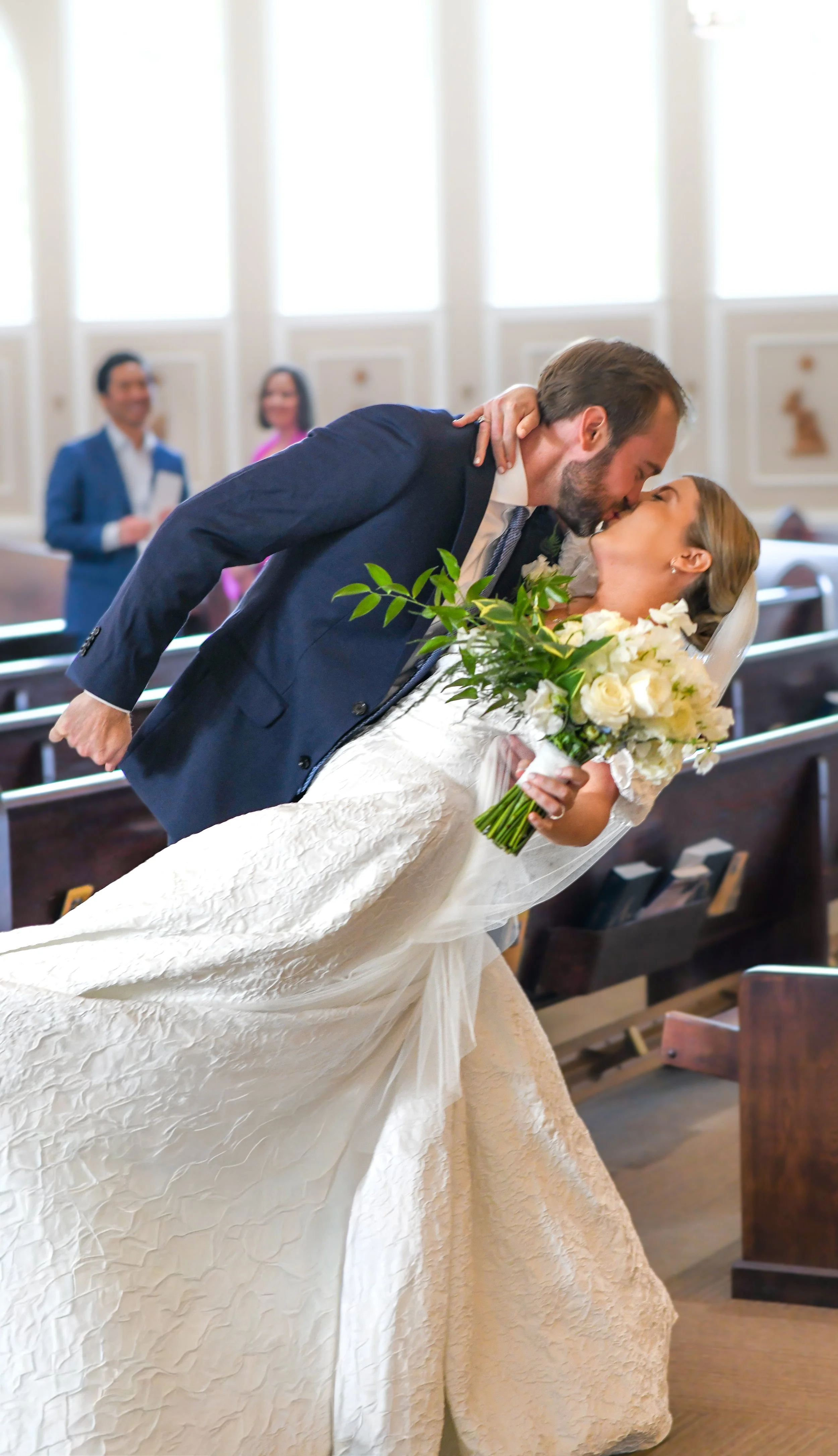 Bride and groom kissing Wedding in Catholic Church at Lake Oconee