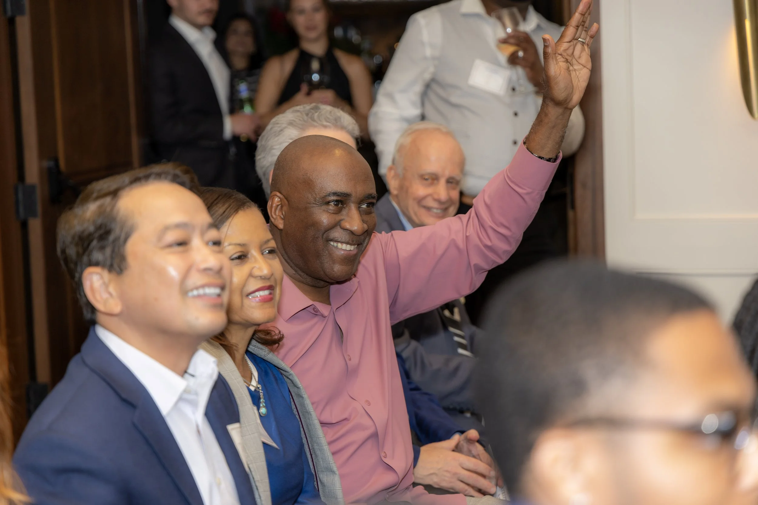 Man raising hand during event photography in Atlanta, GA