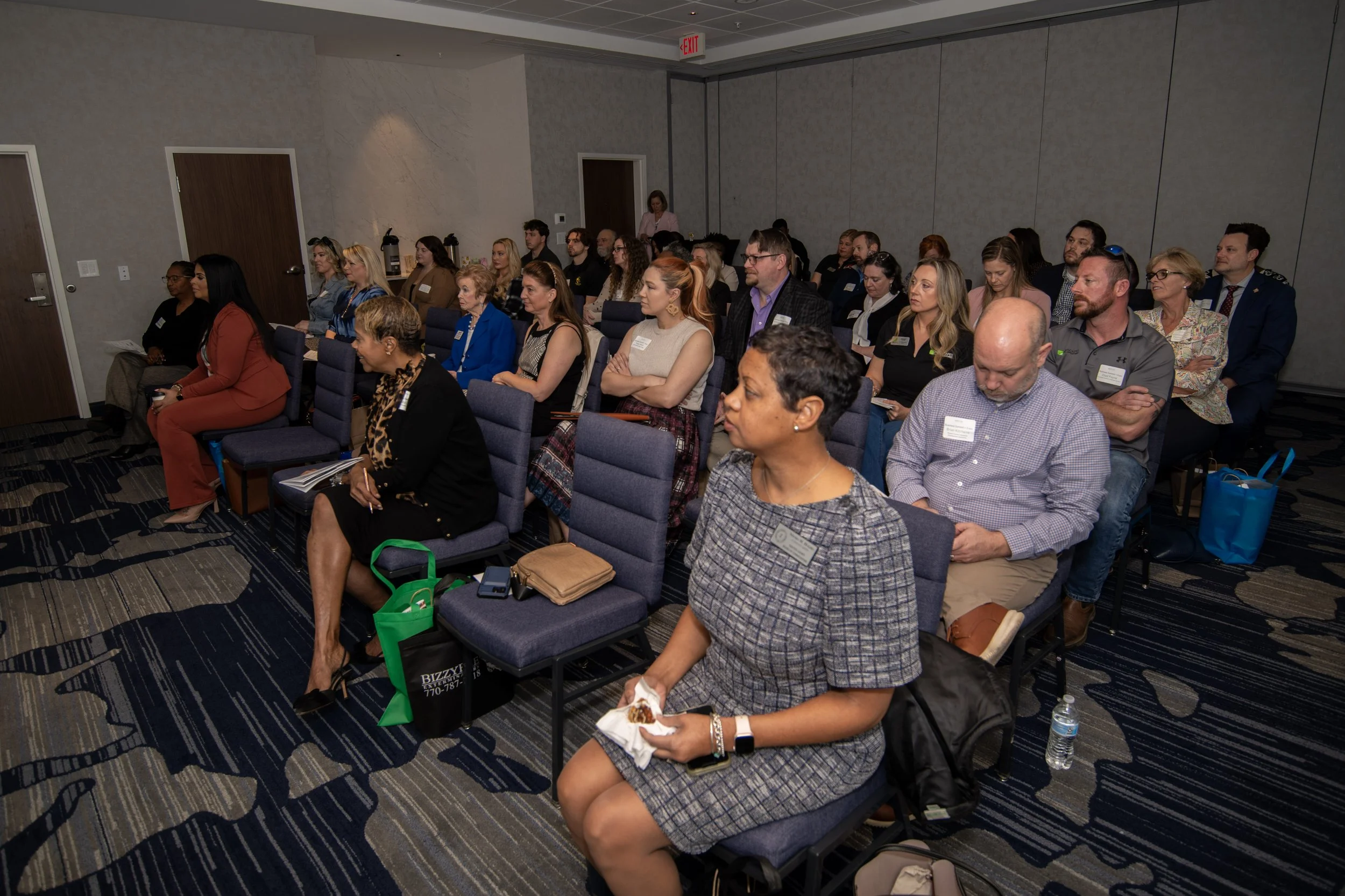Group of conference participants listening to a meeting at Marriott located in Covington, GA