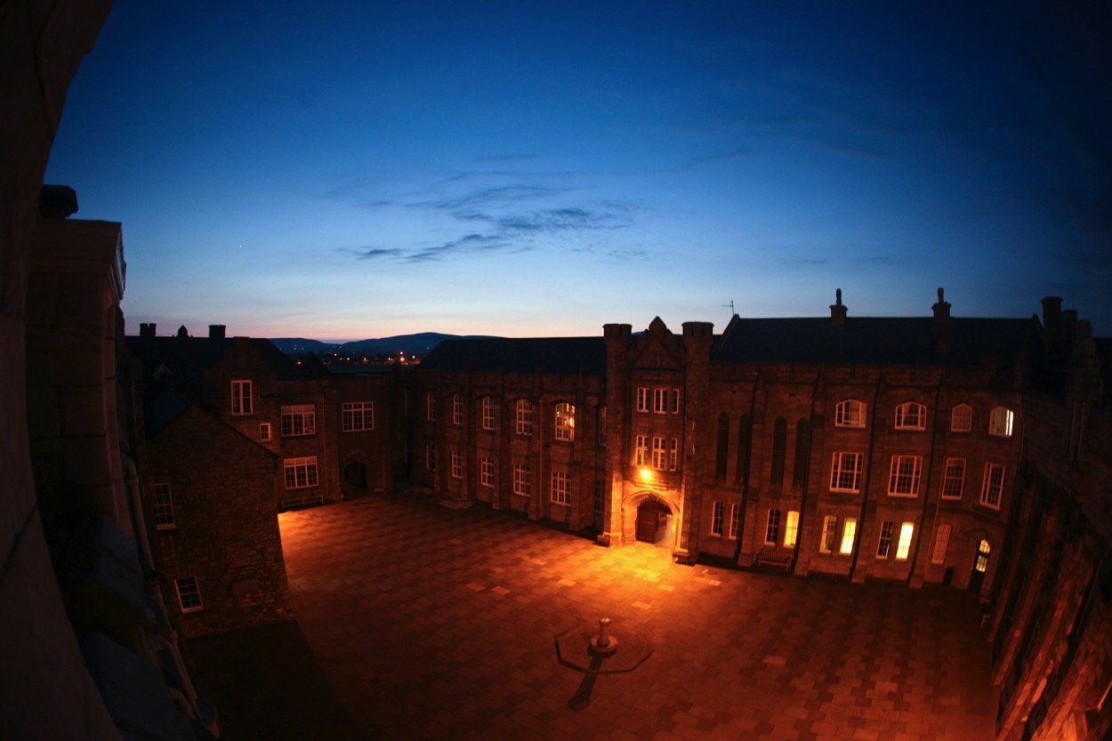 A boarding school courtyard at dusk