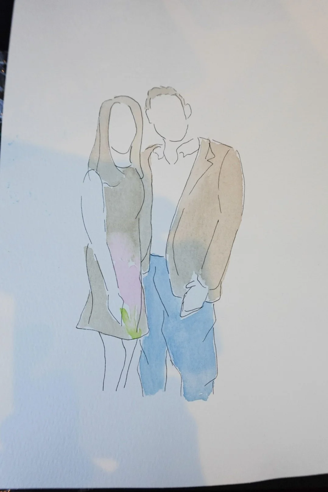 Line drawing of a man and woman standing close, with the woman in a dress and the man in a blazer and jeans, against a plain background.