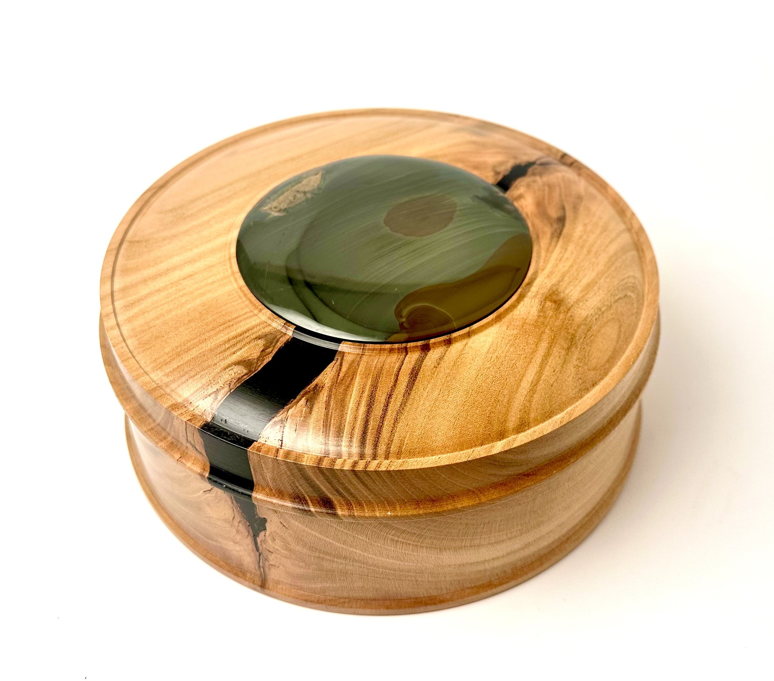 Round wooden box with a lid made from orbicular Blue Mountain Jasper sourced from near the McDermitt Caldera.