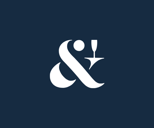 Stylized white ampersand with a martini glass on a dark blue background. Brand identity for a mobile bar