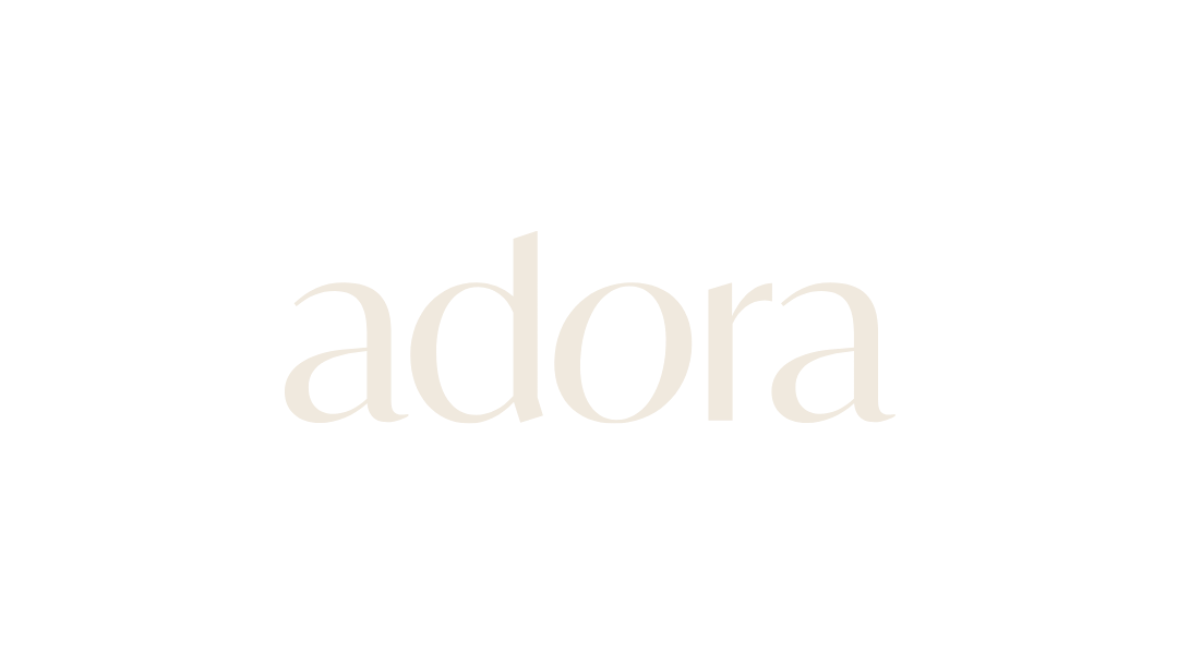 The logo of the fashion and beauty brand 'A D O R A' in white text on a black background.