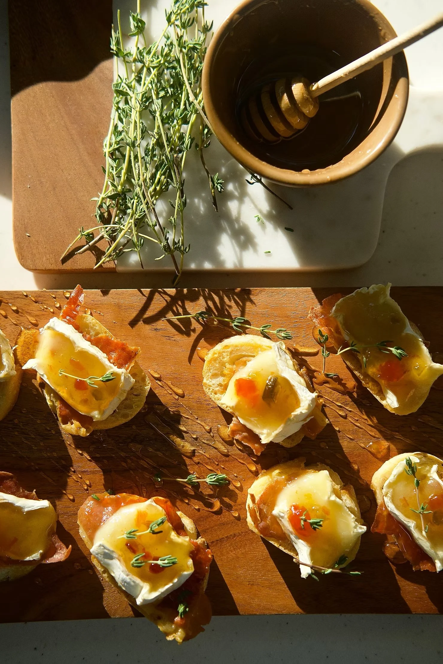Toasty Brie &amp; Prosciutto Crostini with Pepper Jelly and Hot Honey