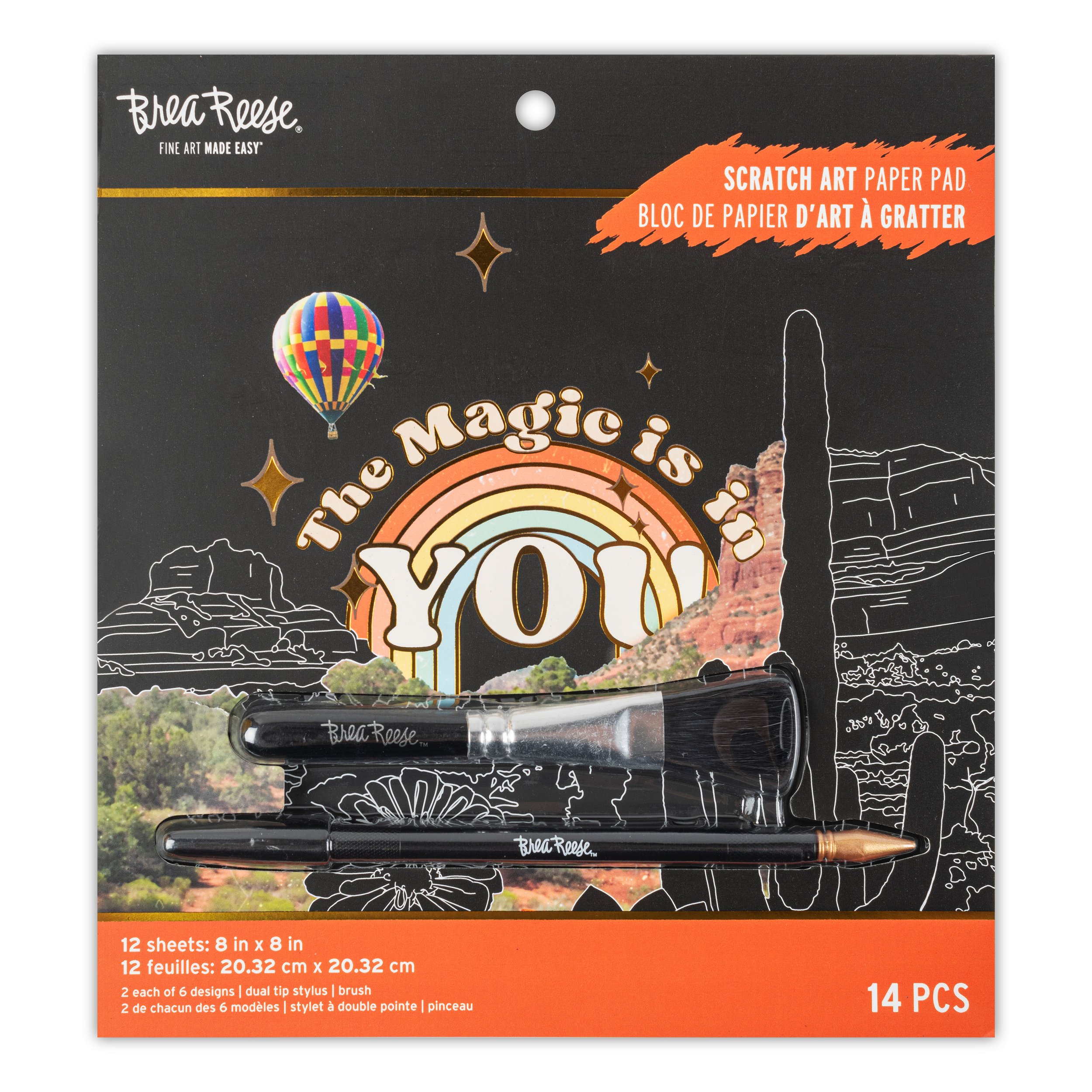 A package of Broa Reese scratch art paper pads titled 'The Magic is in You'. The packaging features a rainbow, hot air balloon, desert landscape with rock formations, and cacti. The package contains 12 sheets of 8x8 inch scratch art paper and 14 dual tip stylus brushes.