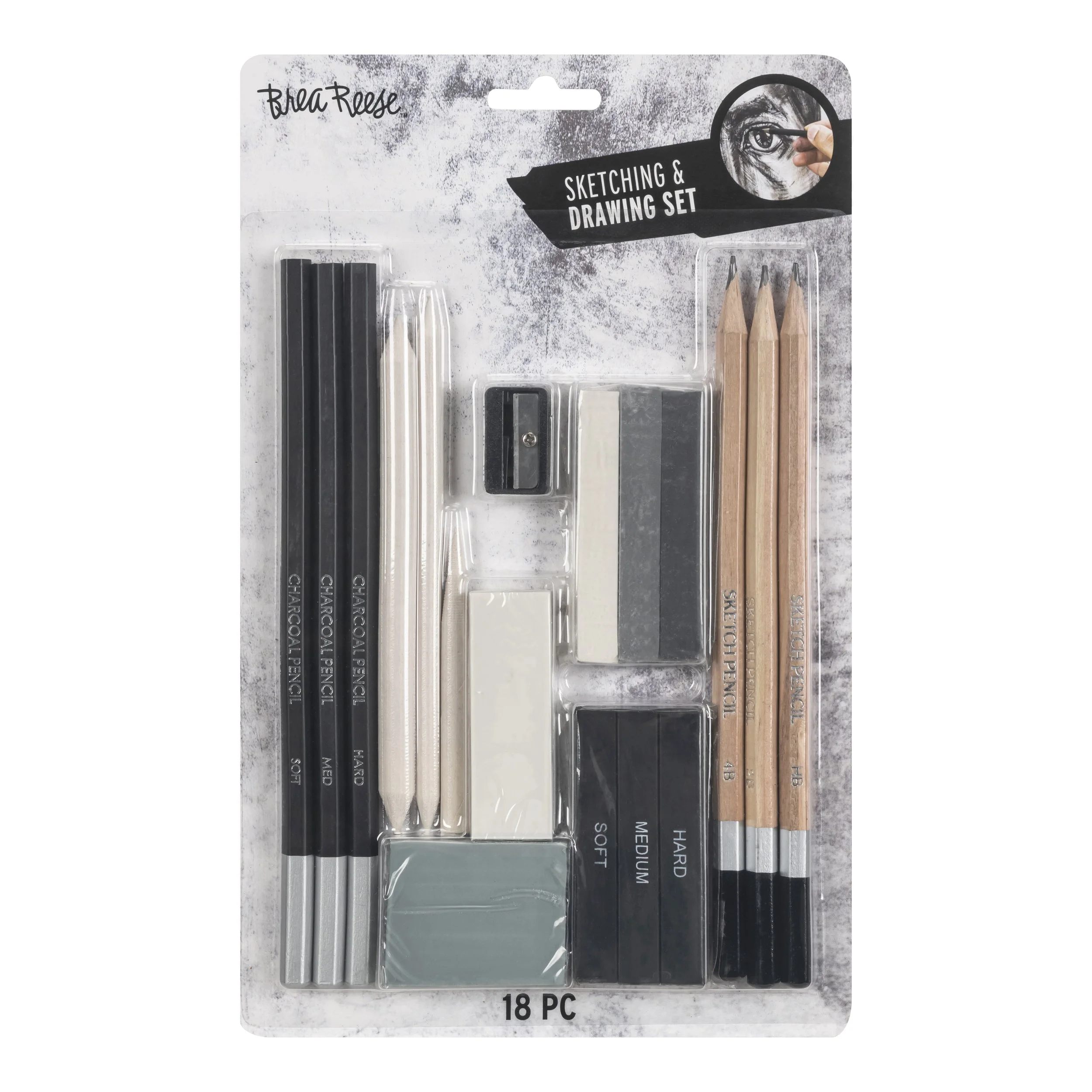 Sketching and drawing set containing black charcoals, white charcoal pencils, erasers, blending tools, and pencils labeled for different shades and hardness levels, packaged in clear plastic with 18 pieces.