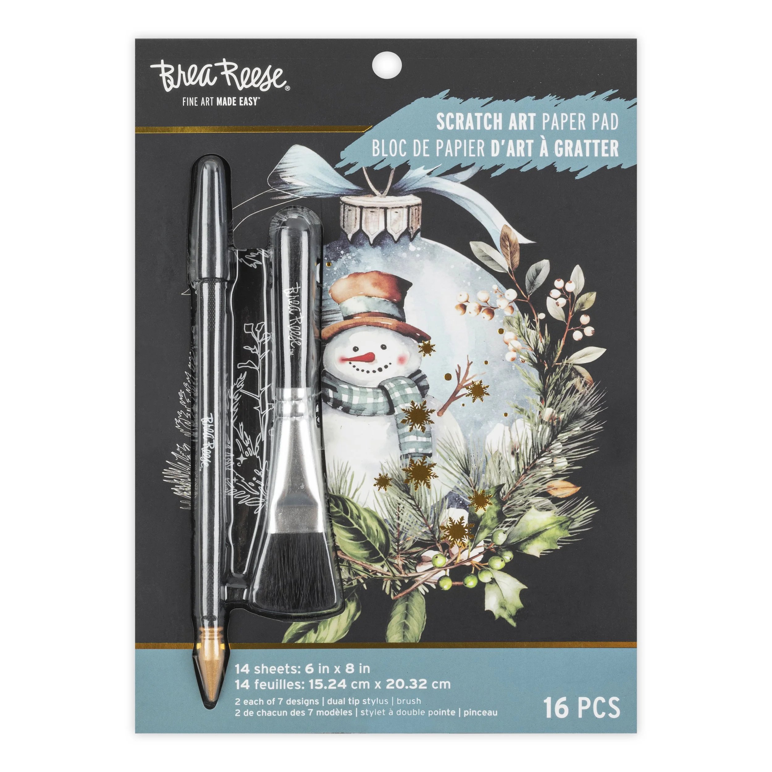 A set of two Tombow Mono Graph dual tip stylus pens in front of a Christmas-themed scratch art paper pad with a snowman illustration and holiday greenery.