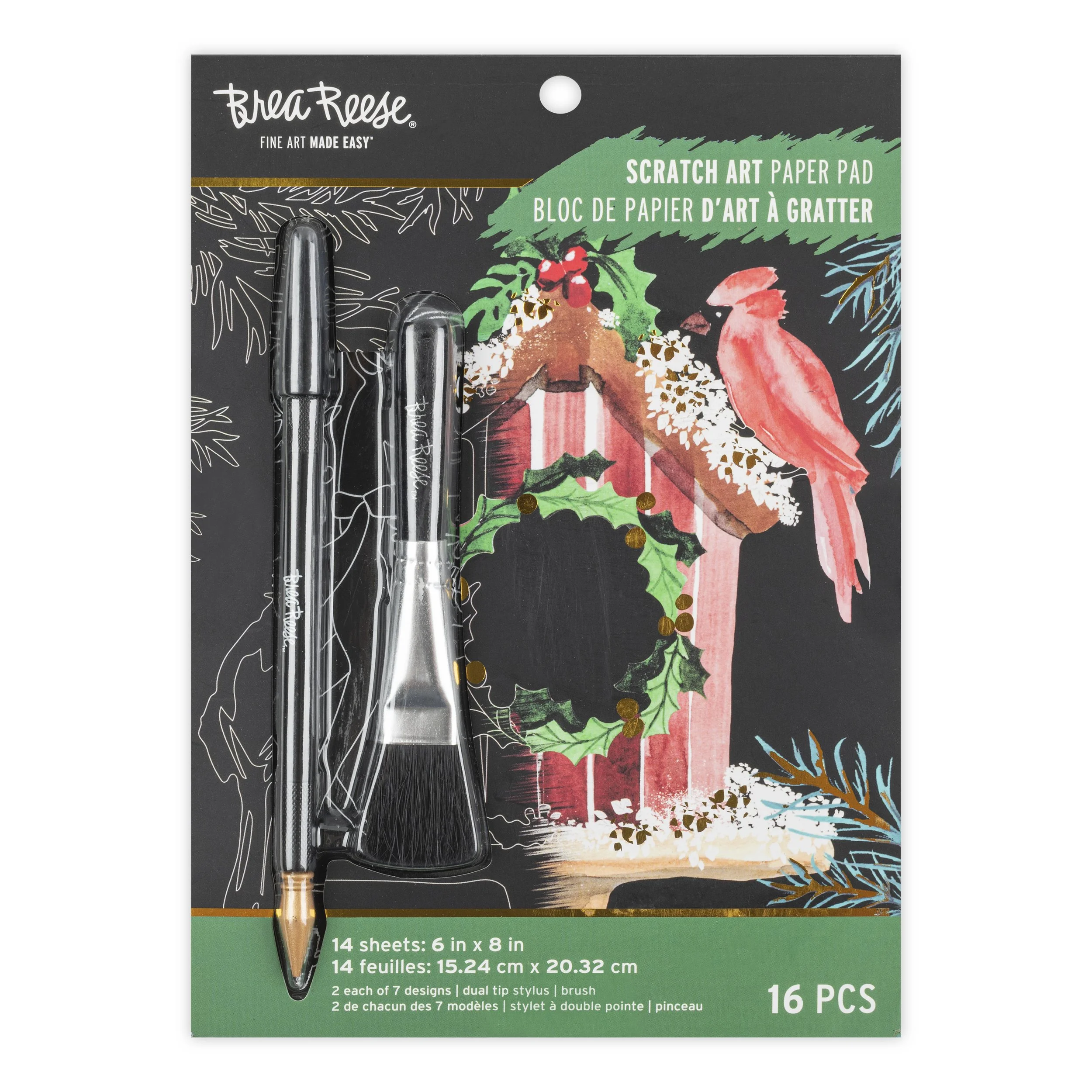 A package of scrapbook paper with two dual-tip stylus brushes, featuring holiday-themed artwork including a bird, holly, and a red barn with a wreath.