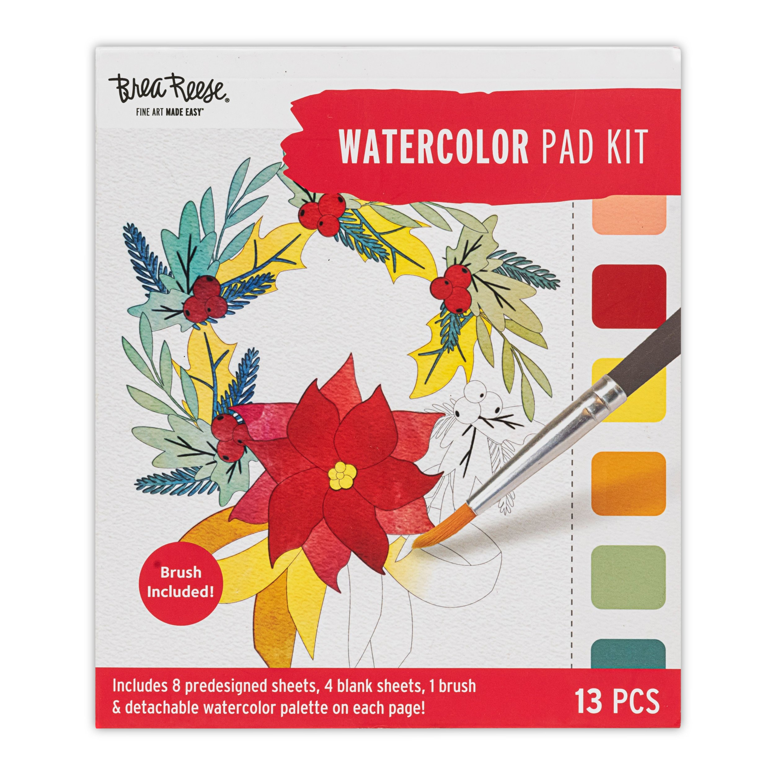 Watercolor pad kit packaging with a painted wreath of holiday foliage, berries, and a poinsettia flower, showing a watercolor brush and color palette.