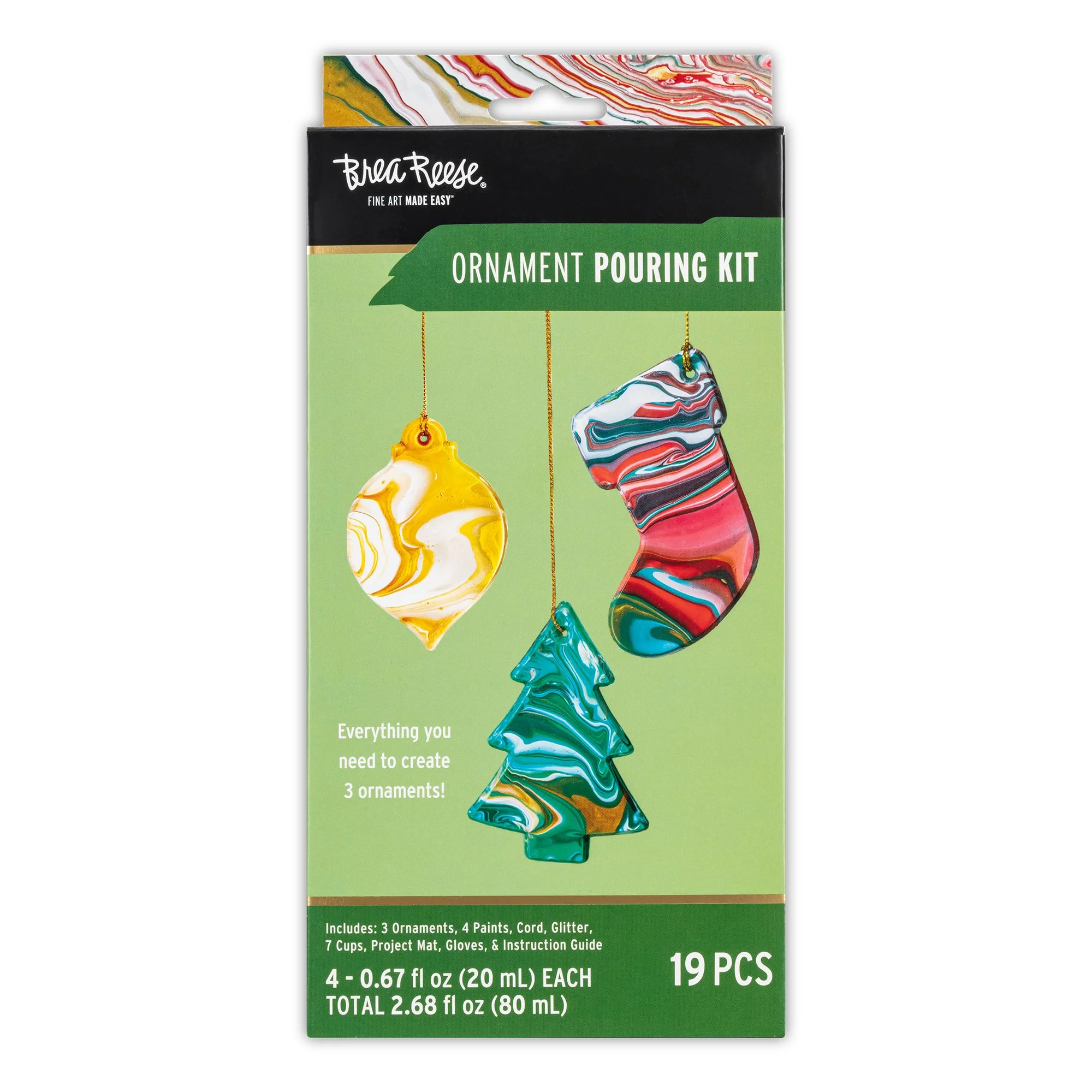 Package of Brea Reese ornament pouring kit with three marbled ornaments: a yellow and white ornament, a blue and turquoise tree-shaped ornament, and a red, black, and blue stocking-shaped ornament, with supplies listed at the bottom.