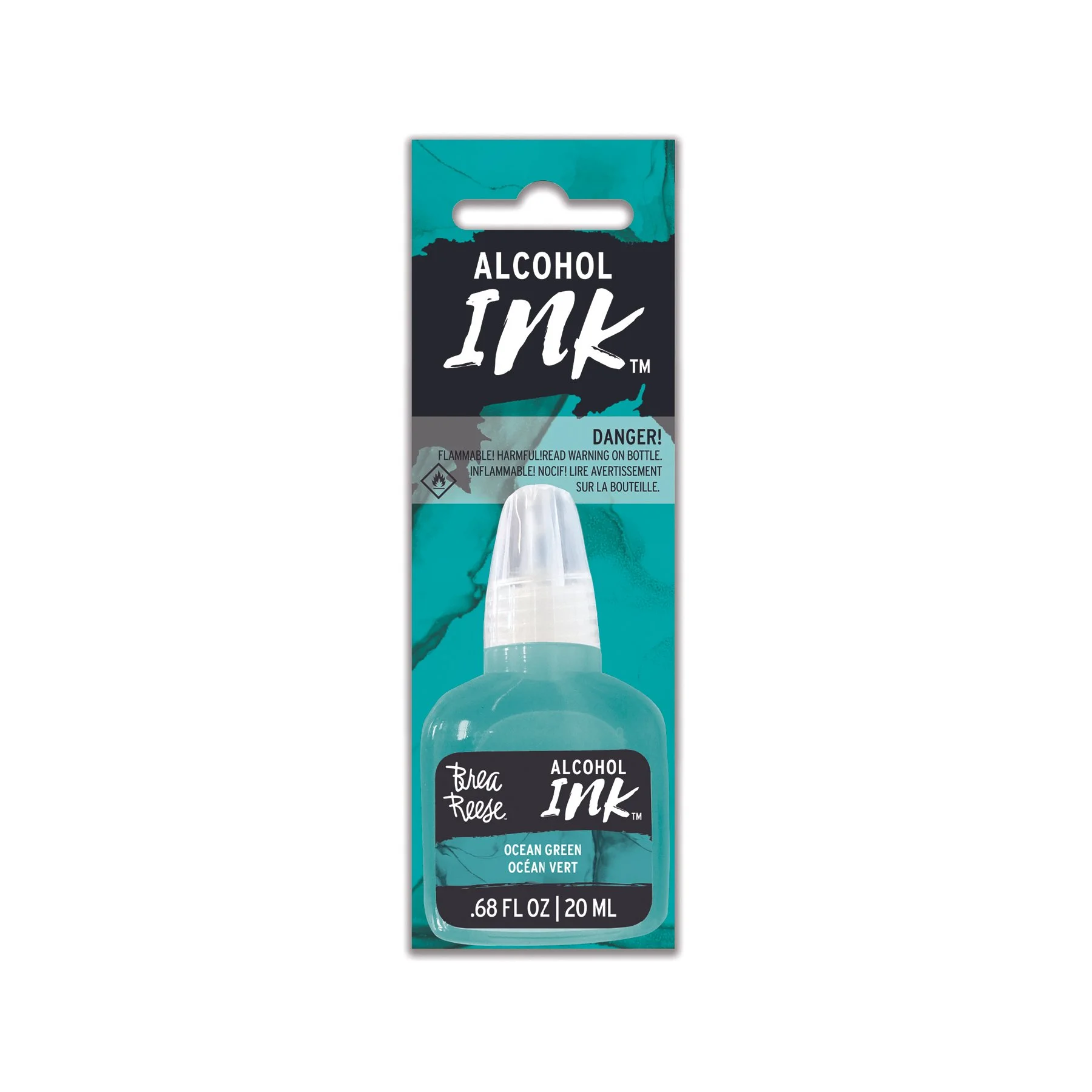 A bottle of alcohol-based ink in ocean green color by Bea Reese, with a needle-tip applicator, in teal packaging with warning labels.