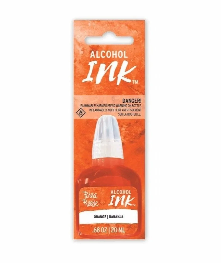 Package of alcohol ink in orange color, labeled Blea Rouge, with a warning about flammability.
