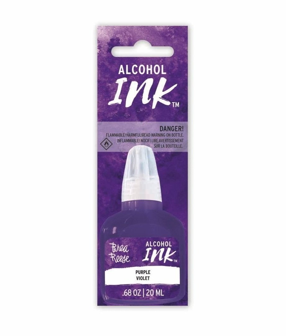 A purple bottle of alcohol ink with a white cap, labeled 'Brea Reese Alcohol Ink, Purple Violet, 0.68 oz, 20 ml,' attached to purple packaging with warning labels.