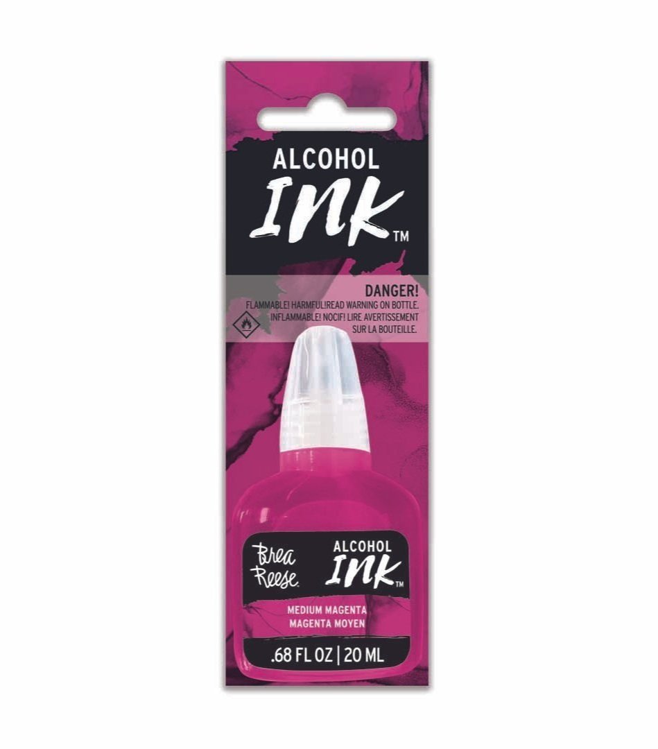 Bottle of alcohol ink in medium magenta color with warning label, packaged in a pink and black cardboard backing.