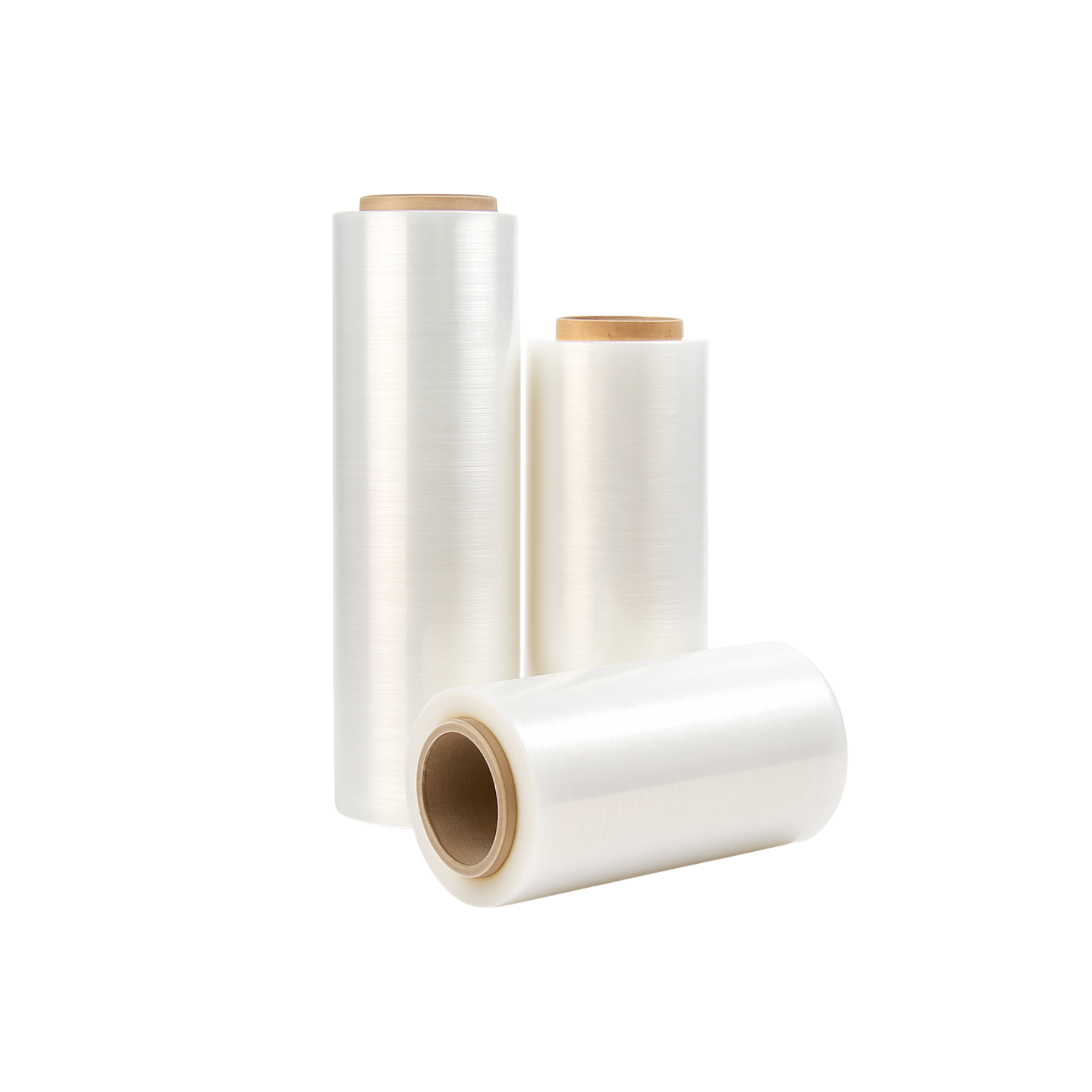 Three rolls of plastic wrap, with two standing upright and one lying down, on a plain background.